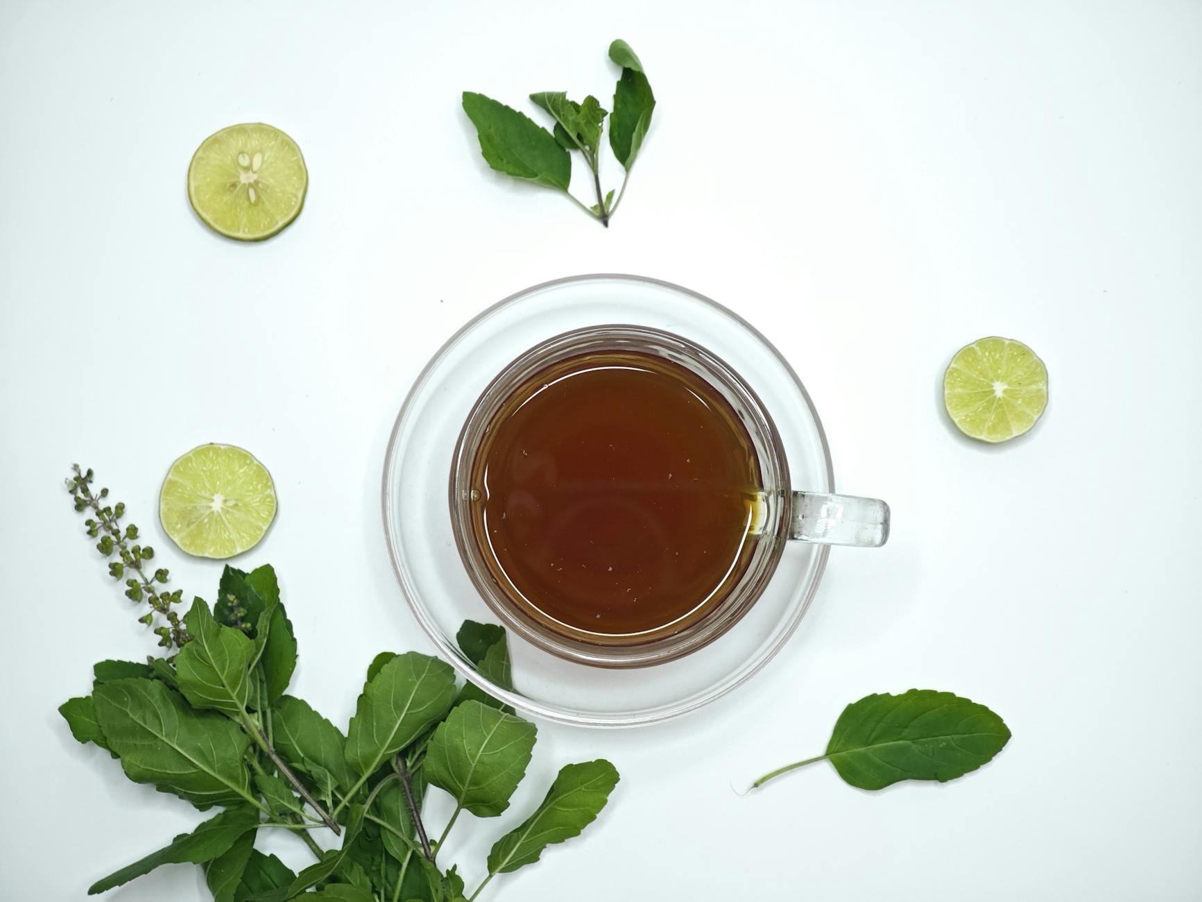 refreshing tulsi tea with lime and fresh herbs Happy Tea: Uplifting Herbs for the Winter Blues