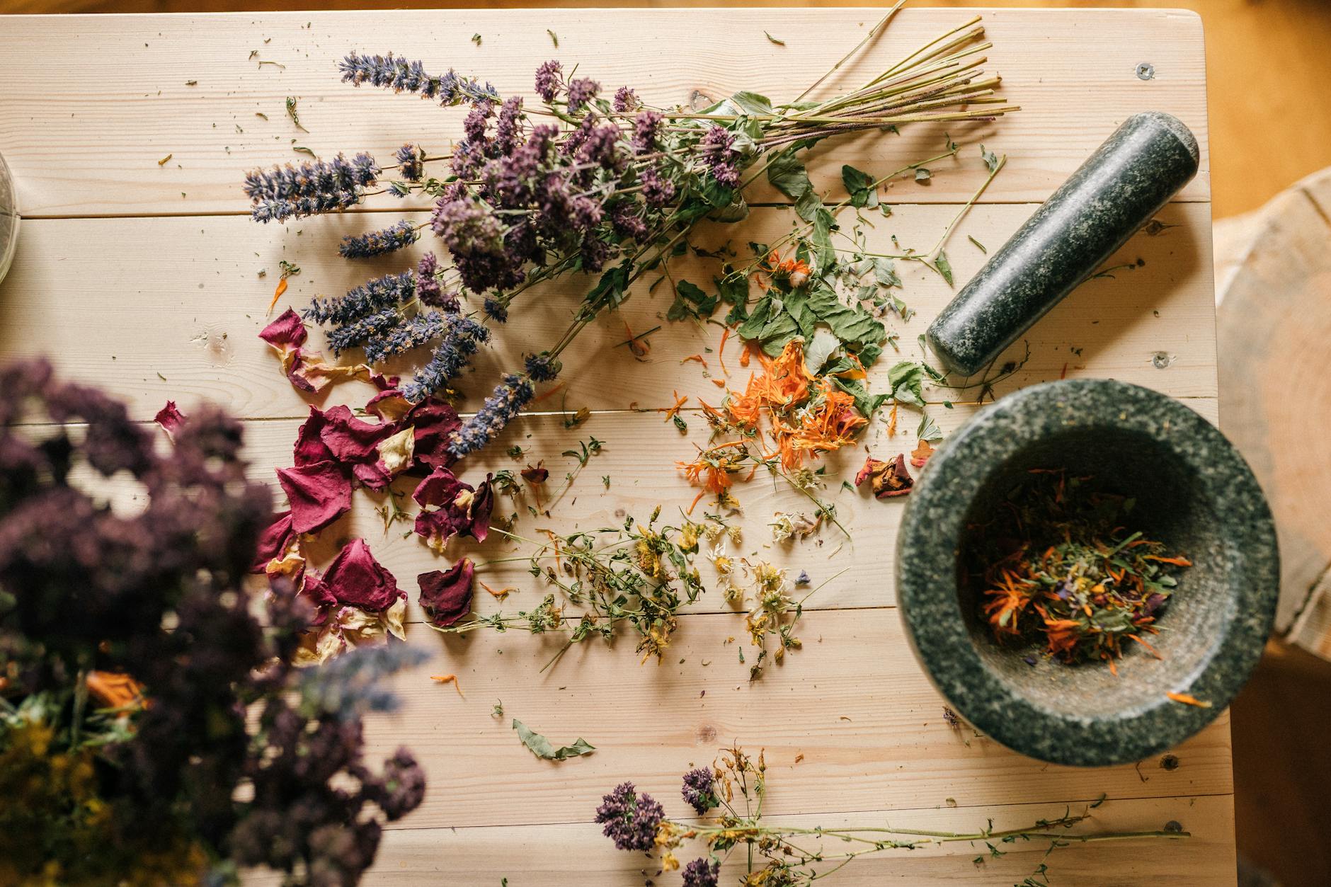 purple flowers on brown wooden table Happy Tea: Uplifting Herbs for the Winter Blues