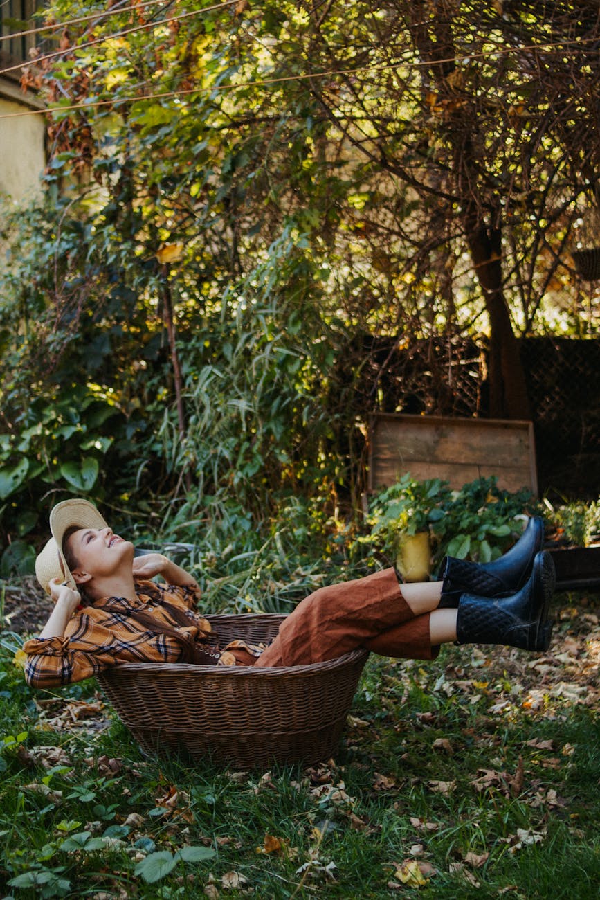 relaxed woman lounging outdoors in autumn garden Gardening in the Fall: 30 Projects and Tasks