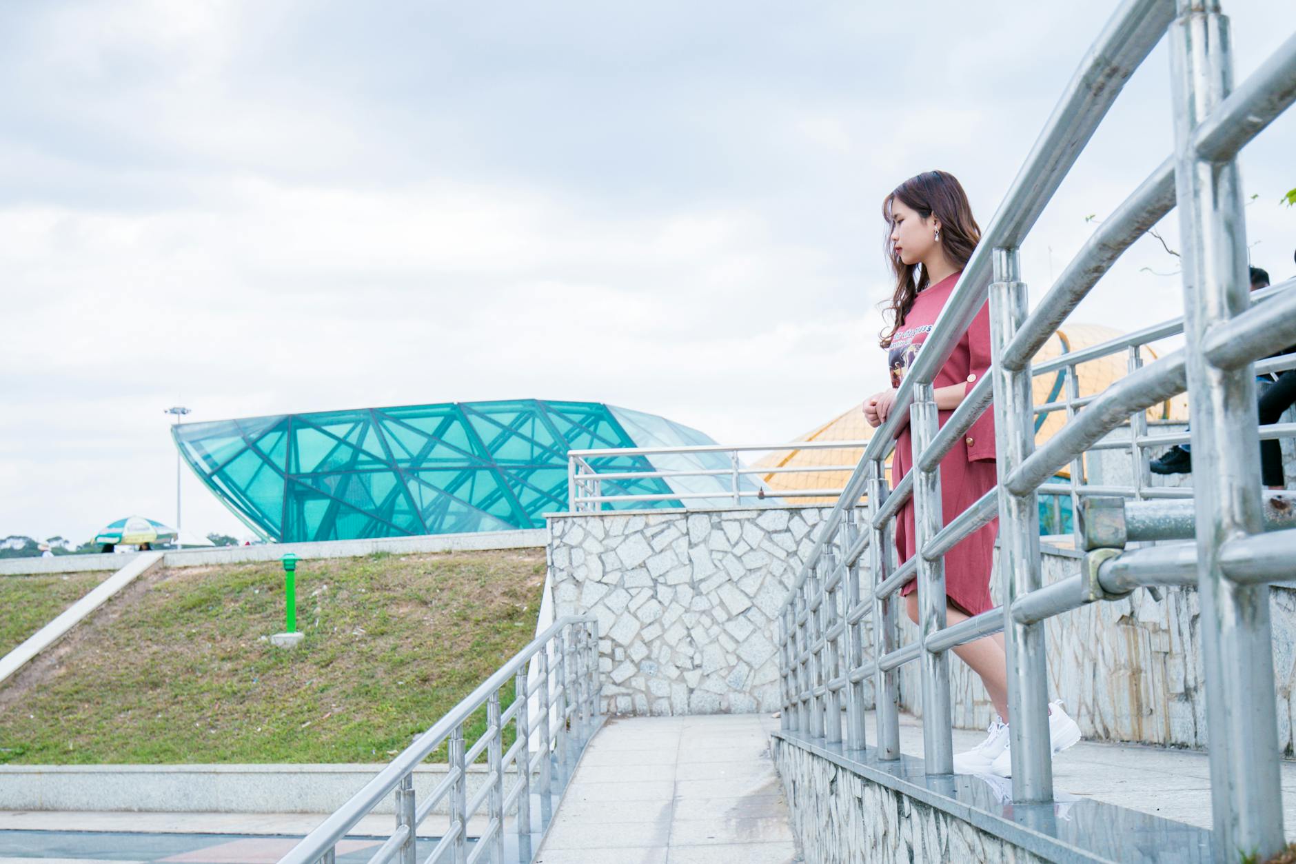 woman wearing red crew neck dress near gray wall 4 Ways to Make Your Business More Accessible
