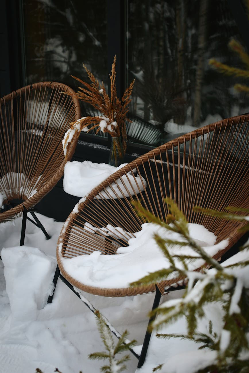winter patio chairs covered in snow The Benefits of Rotating Seasonal Items into Storage
