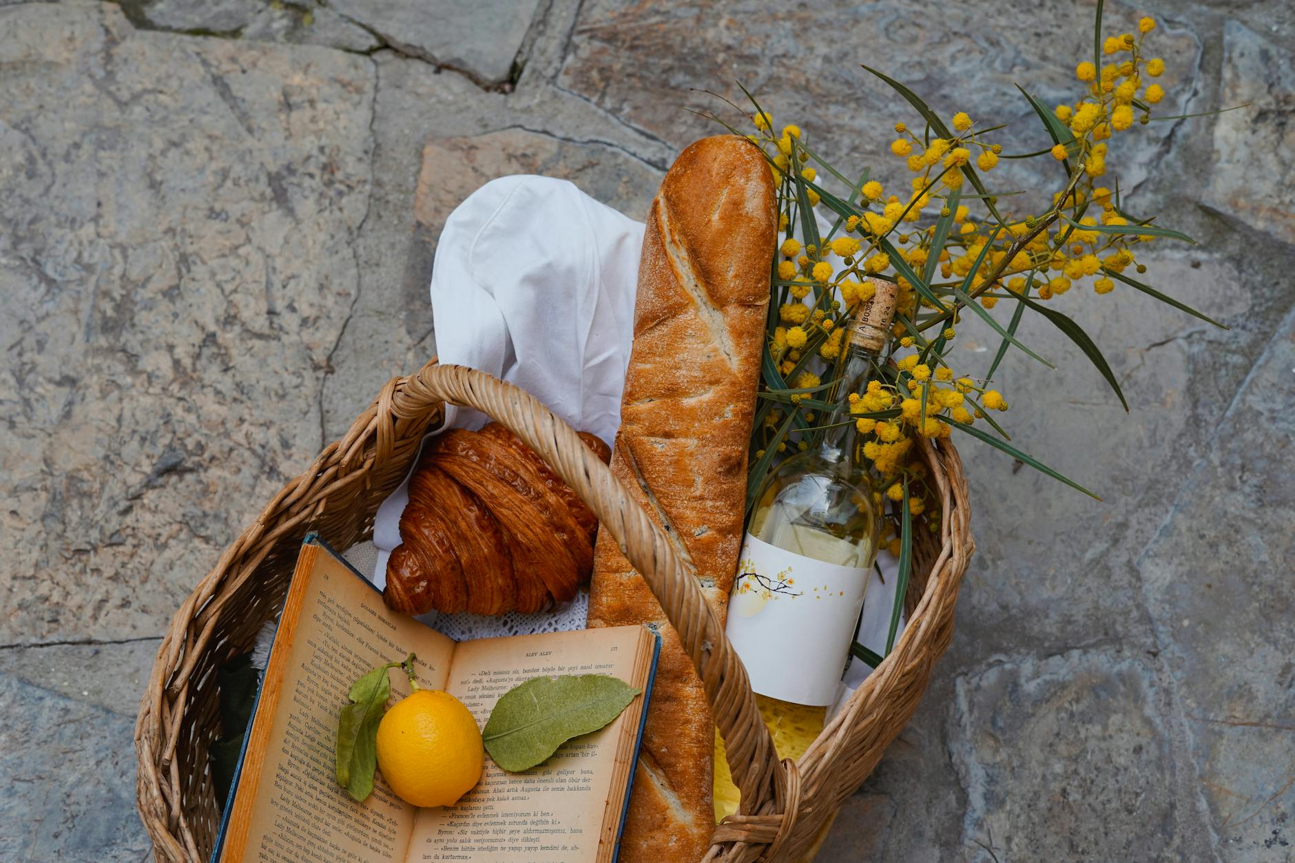 10 Ways to Prep Your Vacation Rental Property for Guests 16 rustic french picnic basket with bread and wine 10 Ways to Prep Your Vacation Rental Property for Guests