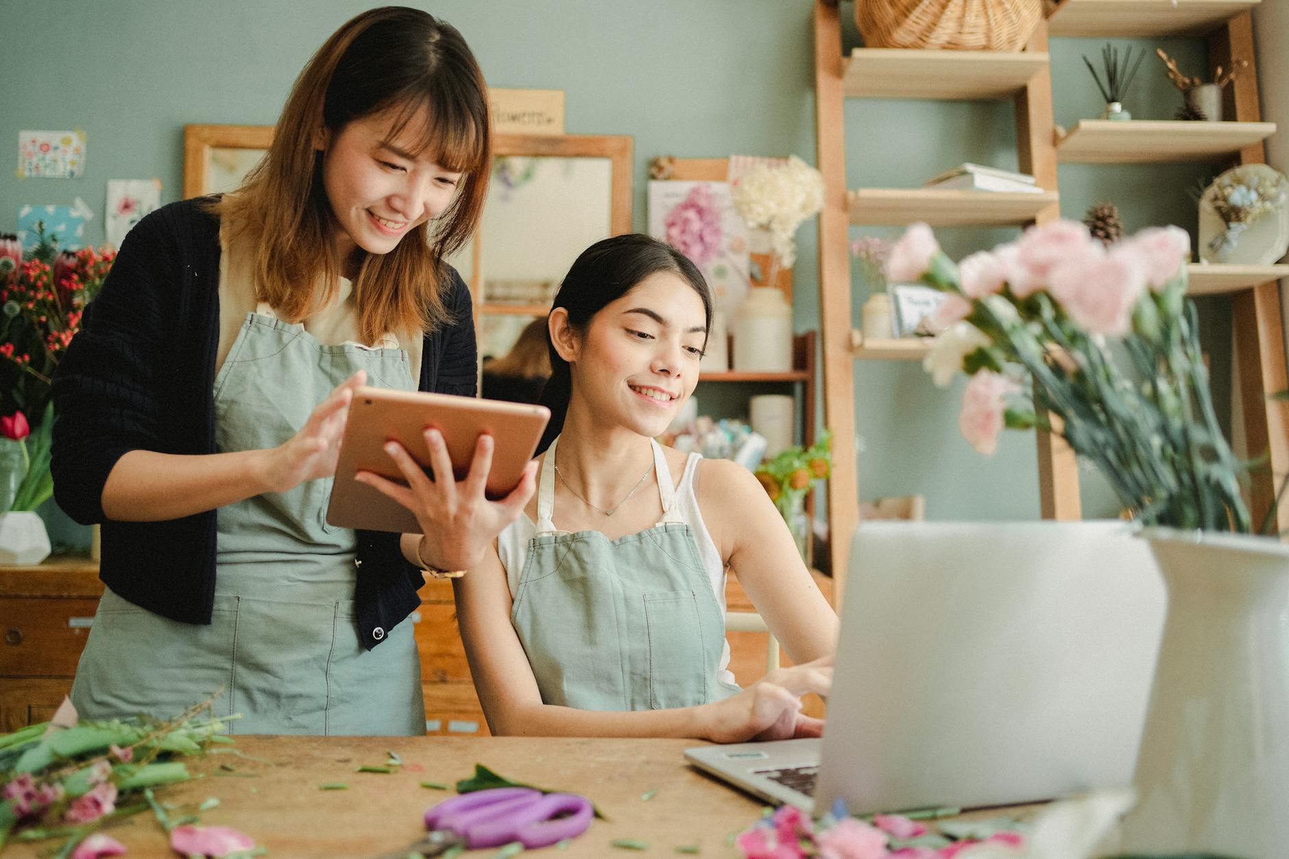 Should You Invest in a Commercial Property or Rent? 10 happy multiracial women working on gadgets in floral store Should you invest in a commercial property or rent?