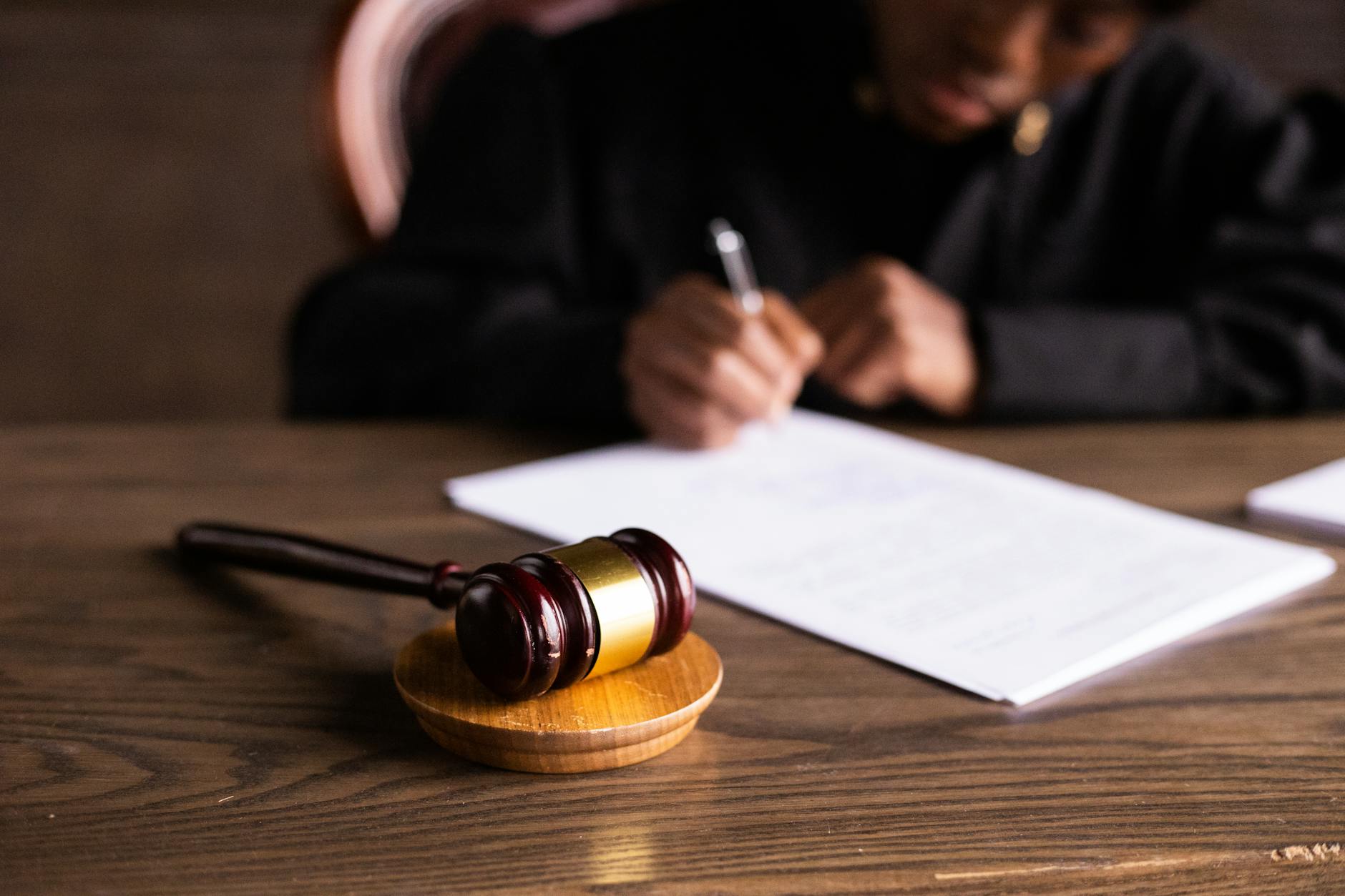 judge signing on the papers How to Handle a Landlord Dispute with Your Tenant
