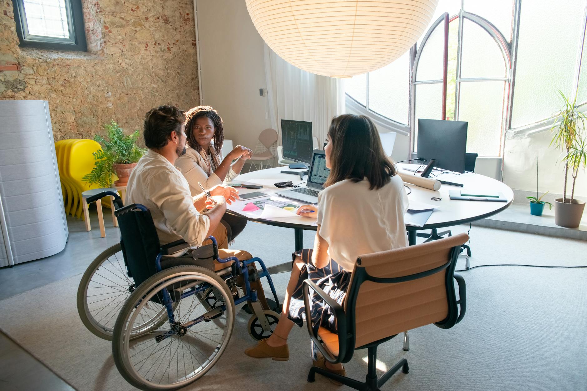 people having a meeting at the  4 Ways to Make Your Business More Accessible