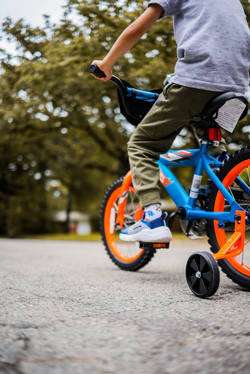 child riding colorful bicycle