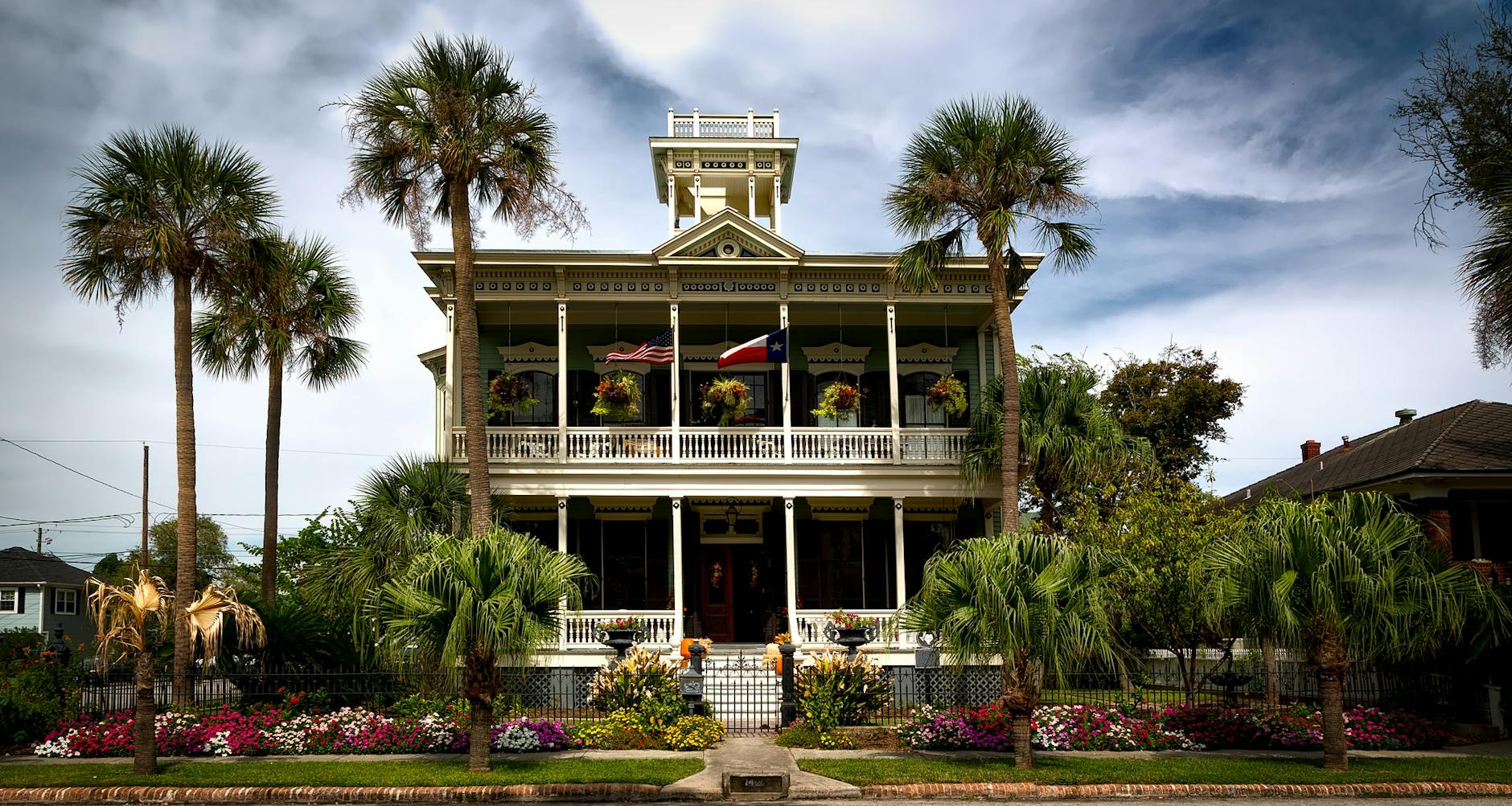 white painted structure with green palm trees in the front 7 Easy Home Upgrades to Enhance Your Listing