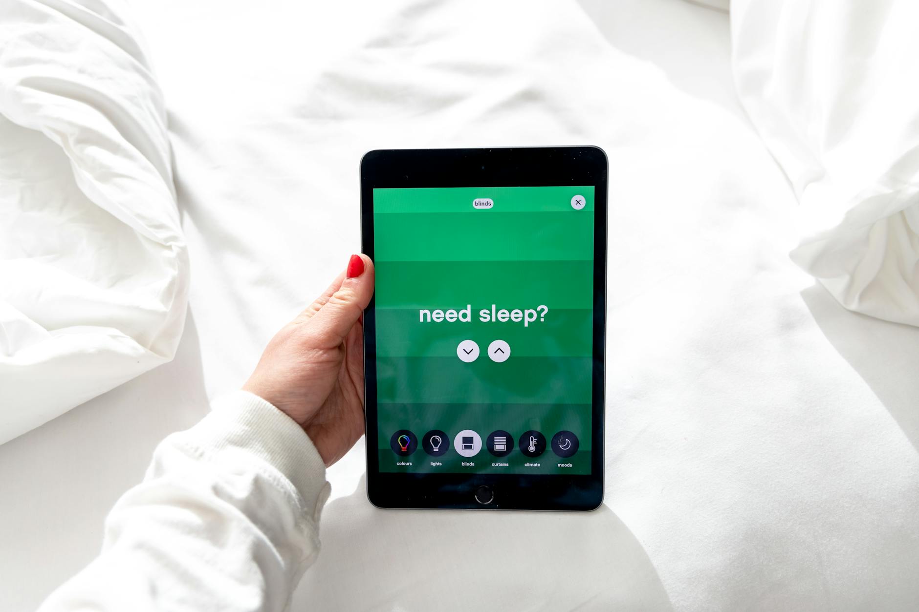 a person holding a digital tablet Use Your Phone to Sleep Better: 3 Effective Tips