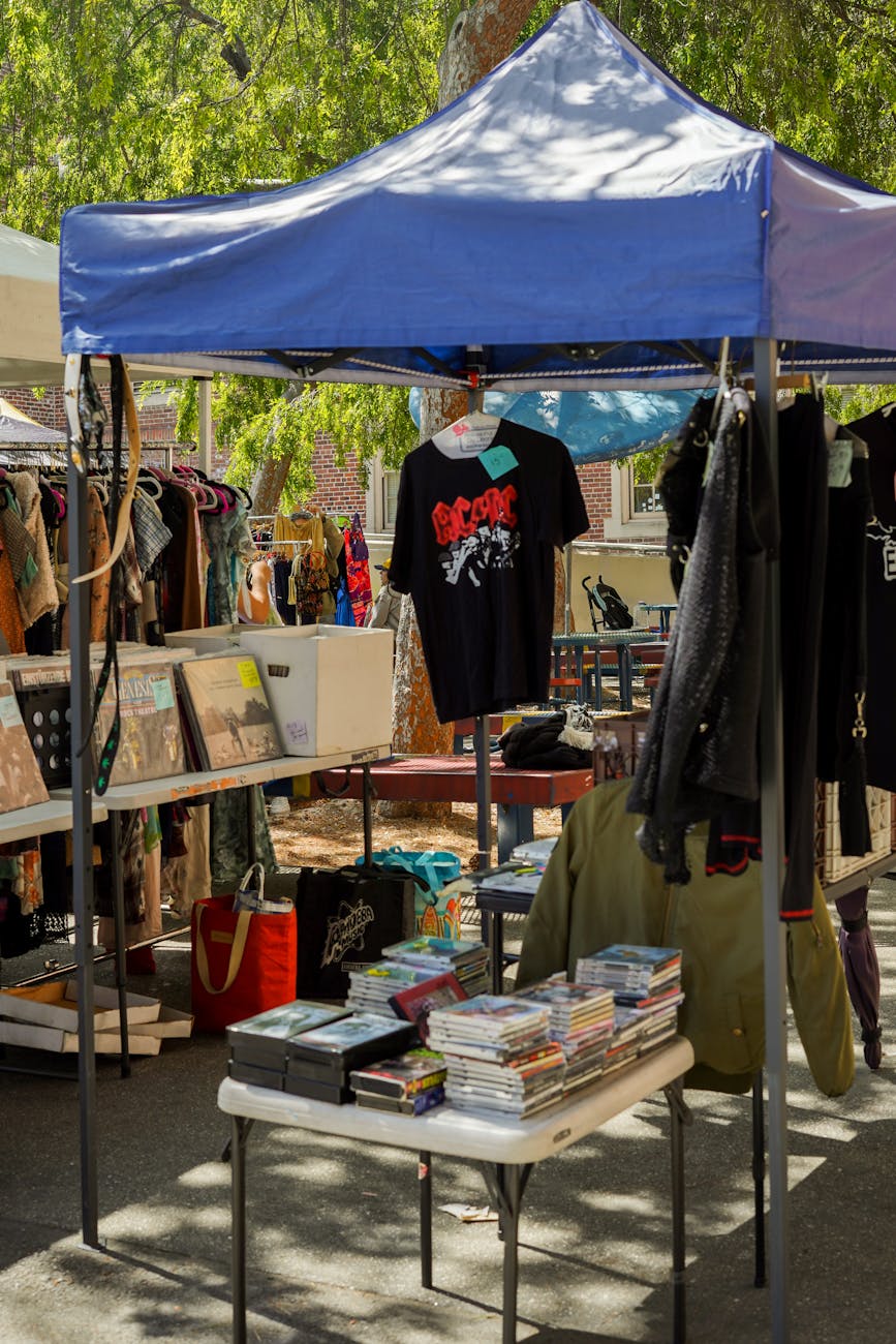 a tent with books and clothing on display How to Survive When You're Struggling Financially