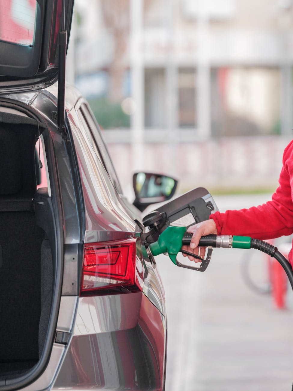 close up of a person refueling the car at a gas station Why Fuel Costs Are The Most Important Expense For Your Fleet Business