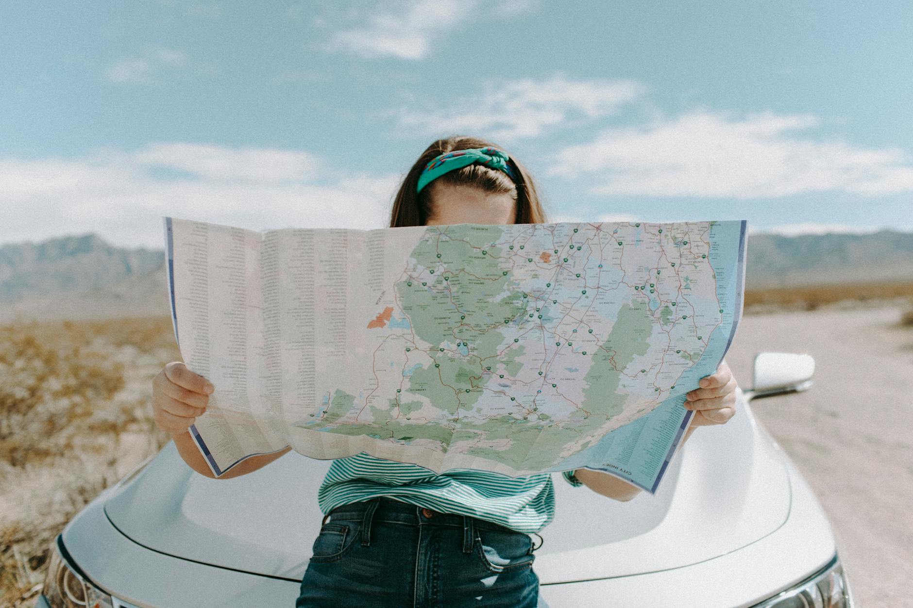 How to Choose the Perfect Location to Invest in Real Estate 13 woman looking at the map How to Choose the Perfect Location to Invest in Real Estate