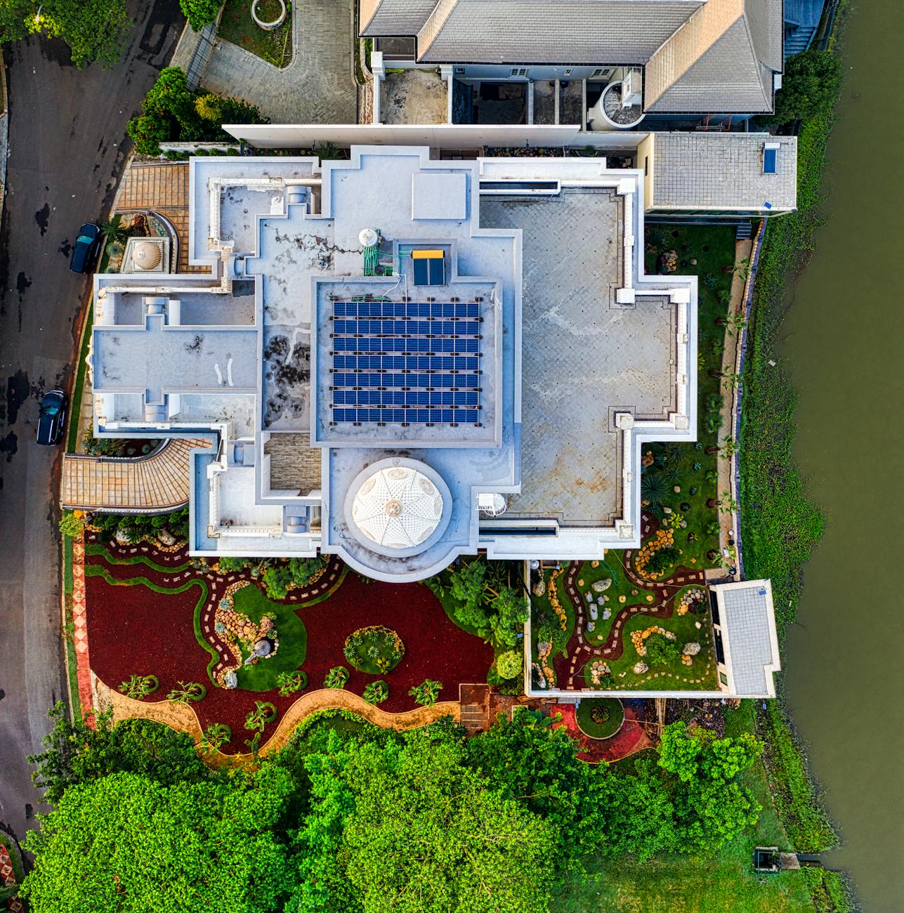 drone shot of a mansion on a coast How To Make Your Company More Energy Efficient And Carbon-Friendly