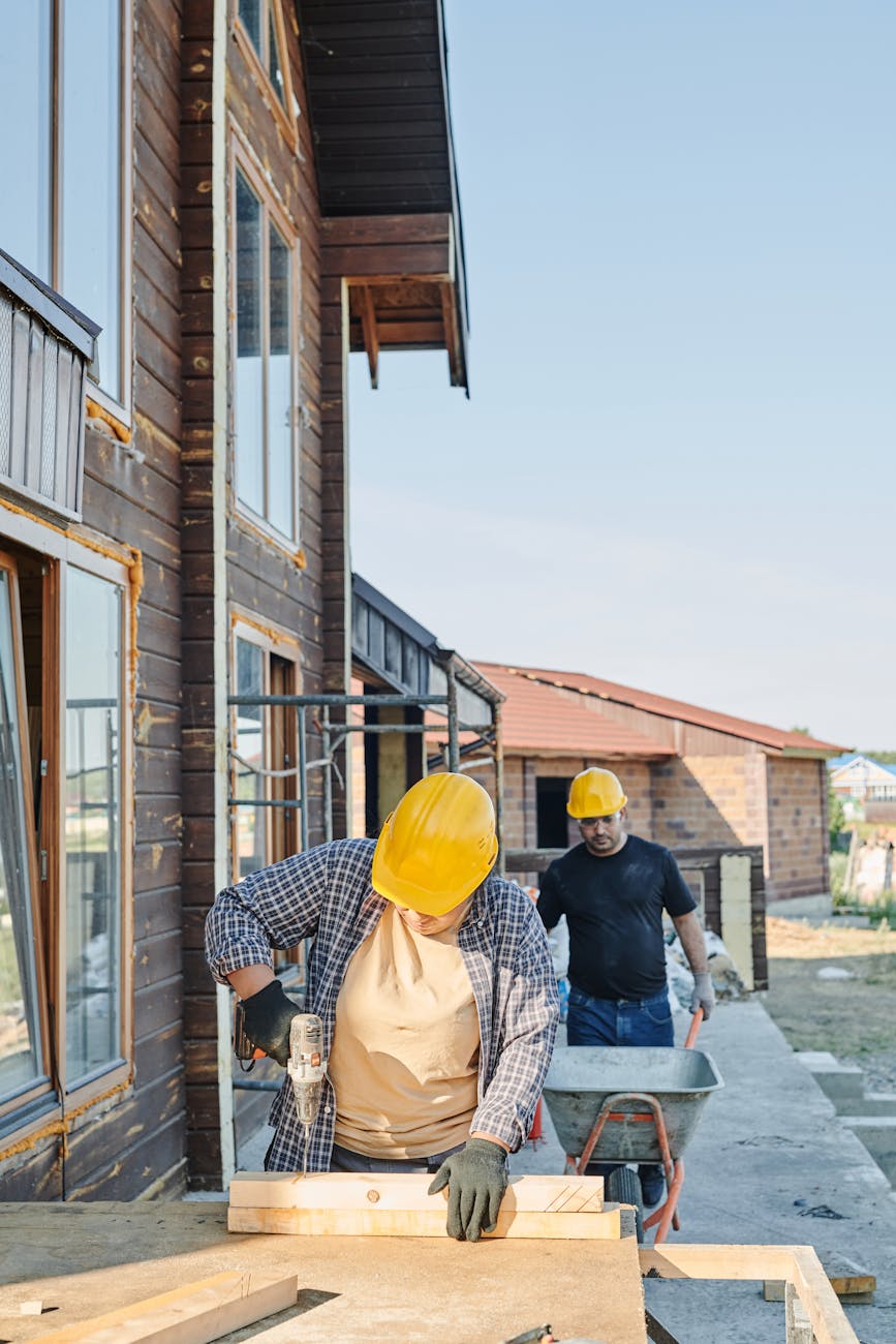 people doing work in the construction site Expert Tips for Buying Your Next Home or Investment Property