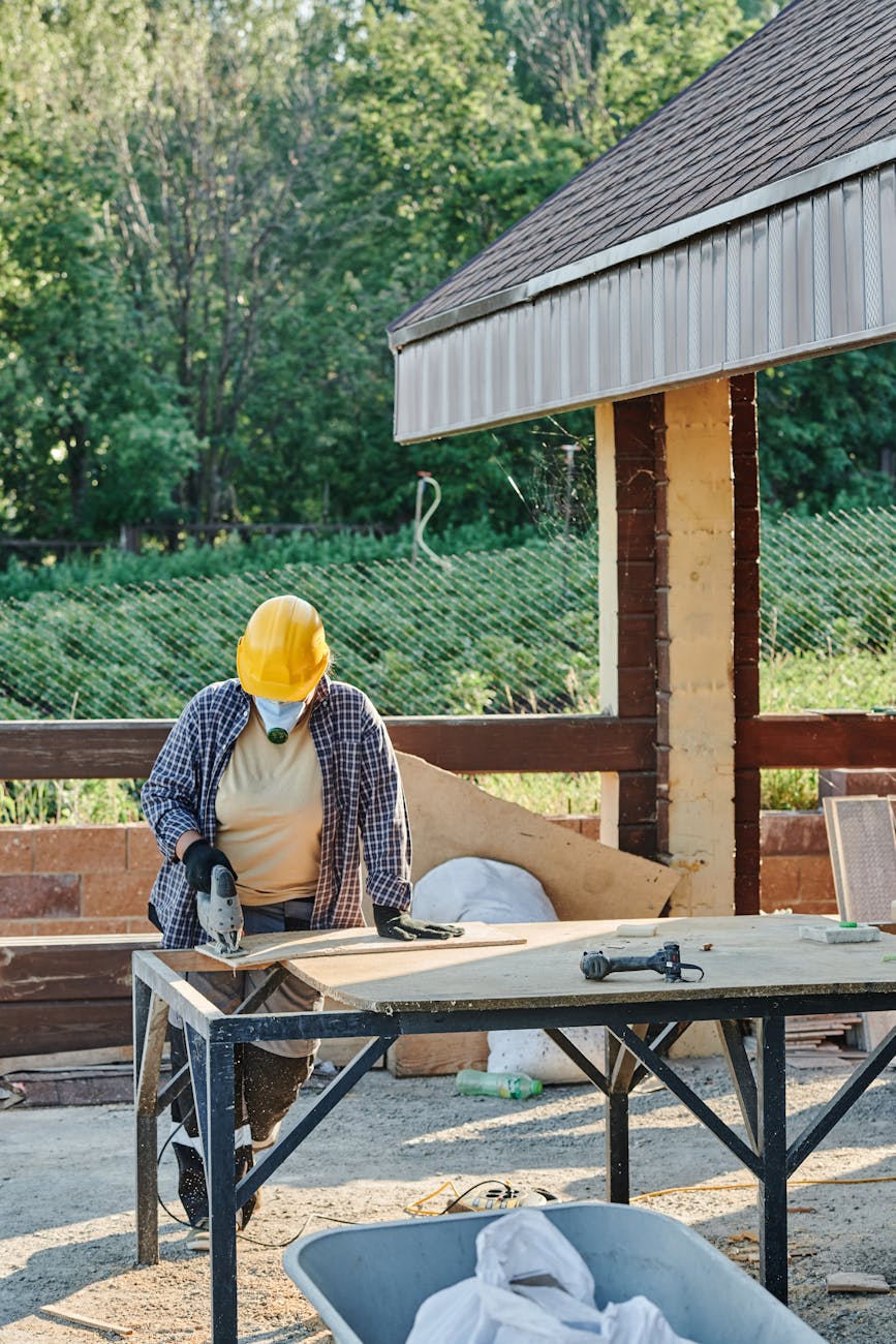 a construction worker using a jigsaw Why Building Your Own Home Is Achievable and Affordable