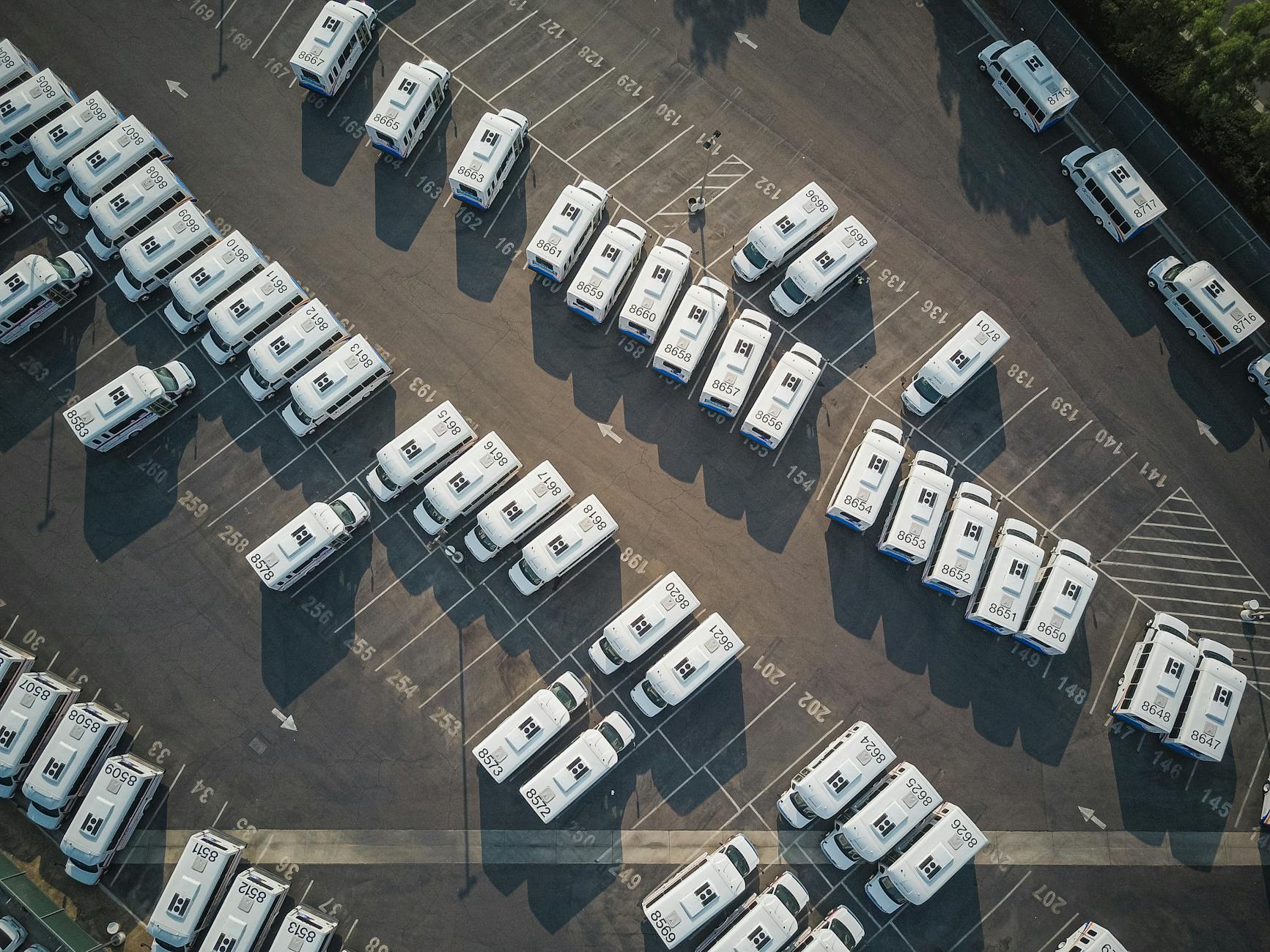 top view shot of vehicles on an open parking lot Why Fuel Costs Are The Most Important Expense For Your Fleet Business