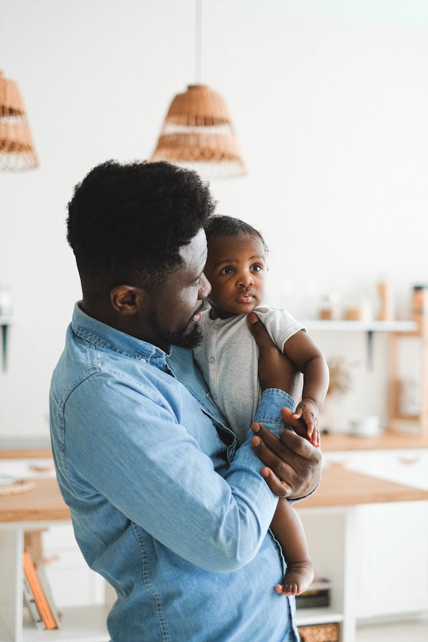a man carrying his baby 9 Times You Need A Lawyer In Your Life