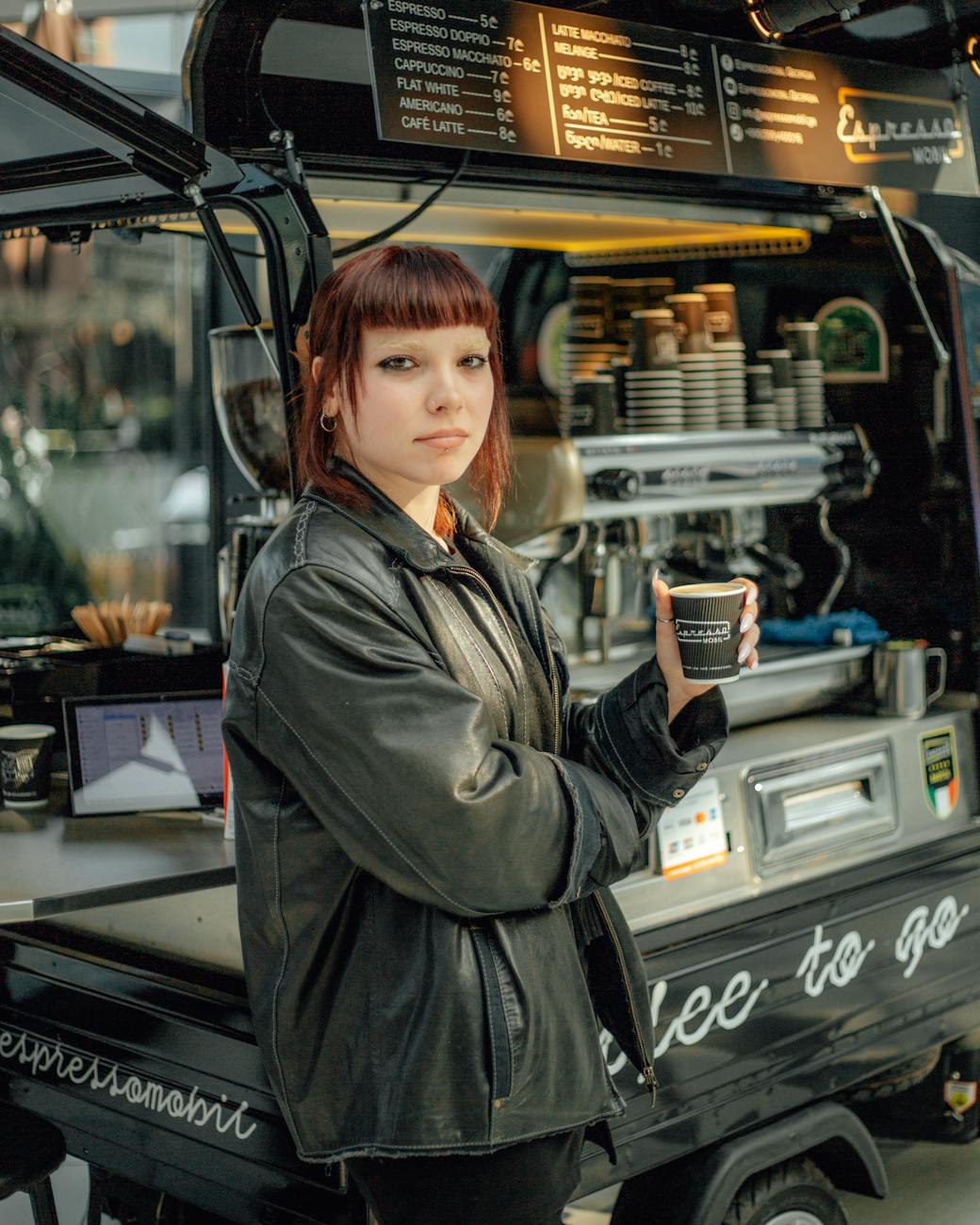 woman posing by coffee stand 3 Reasons to Start a Coffee Cart