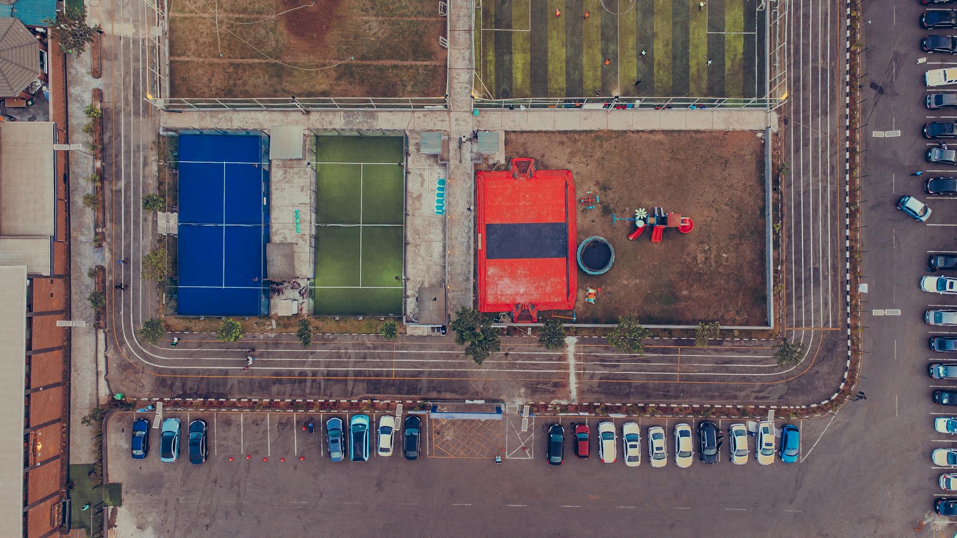 Top Neighborhood Features to Look for When House Hunting 11 aerial view of urban sports complex with parking