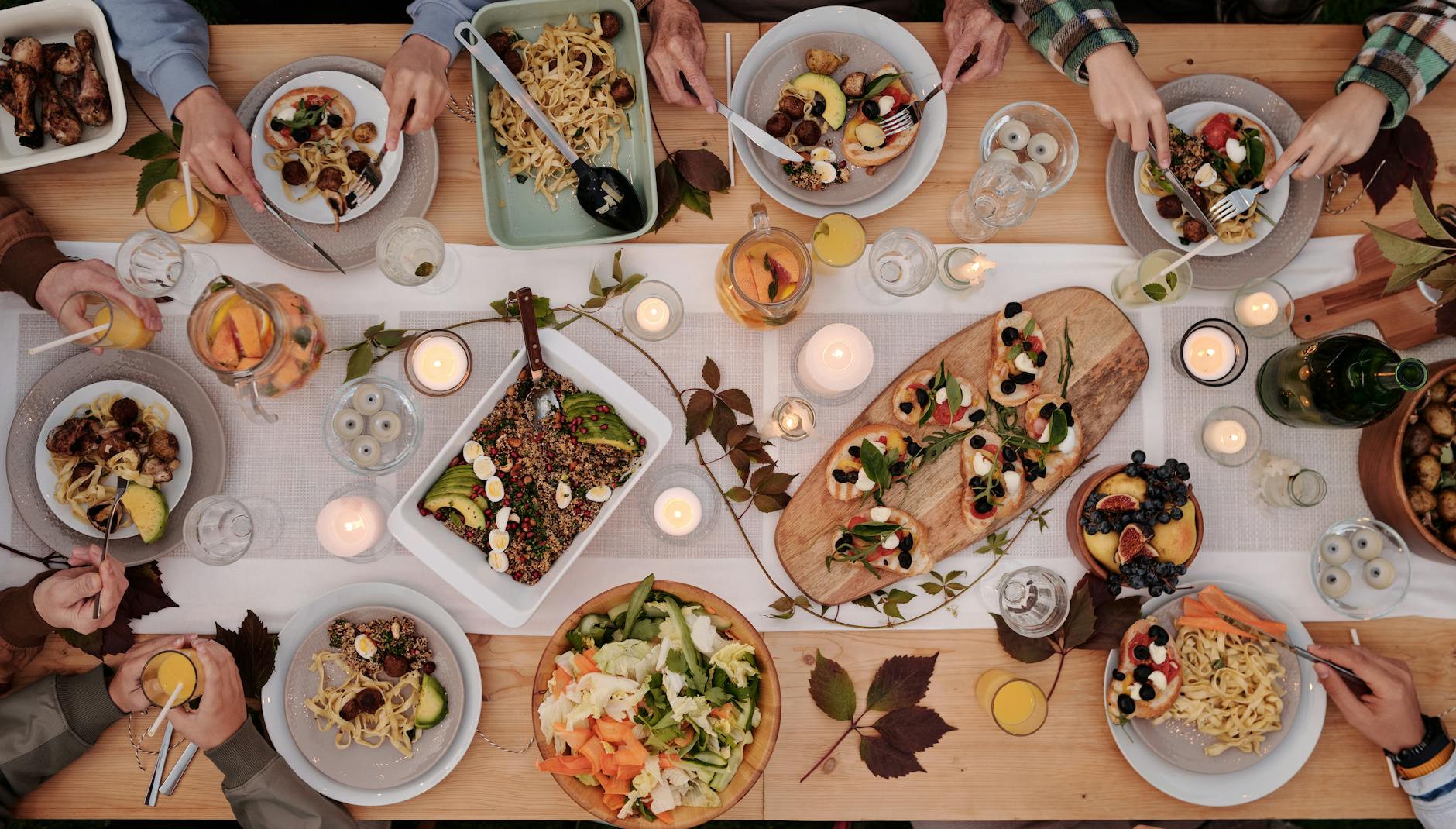 food on decorated table during party How to Set Up a Kitchen From Scratch: STR Hosts & New Homeowners