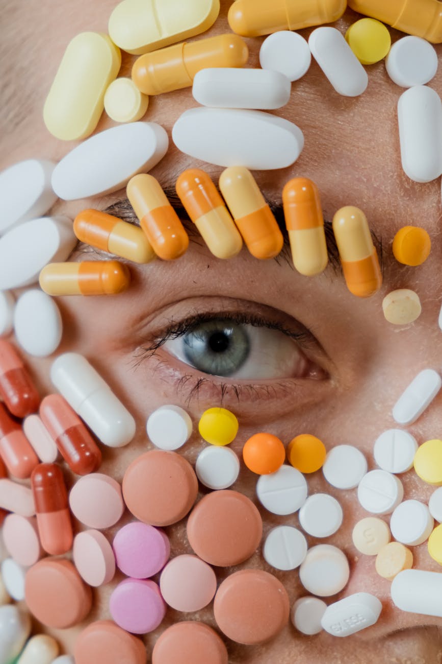 How To React When Health Issues Threaten Your Finances 12 close up photo of assorted medicines surrounding a person s eye
