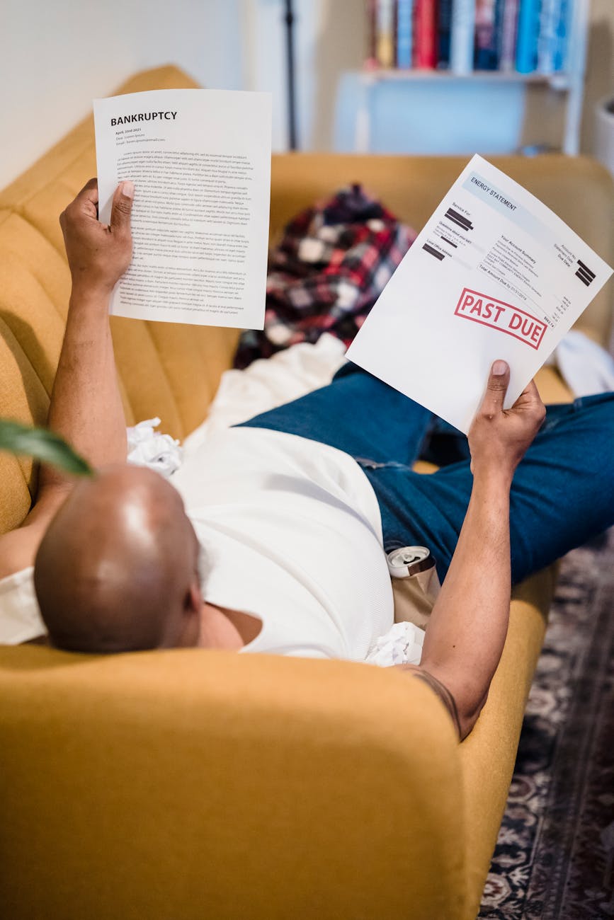 man in white shirt holding white printer paper 9 Times You Need A Lawyer In Your Life