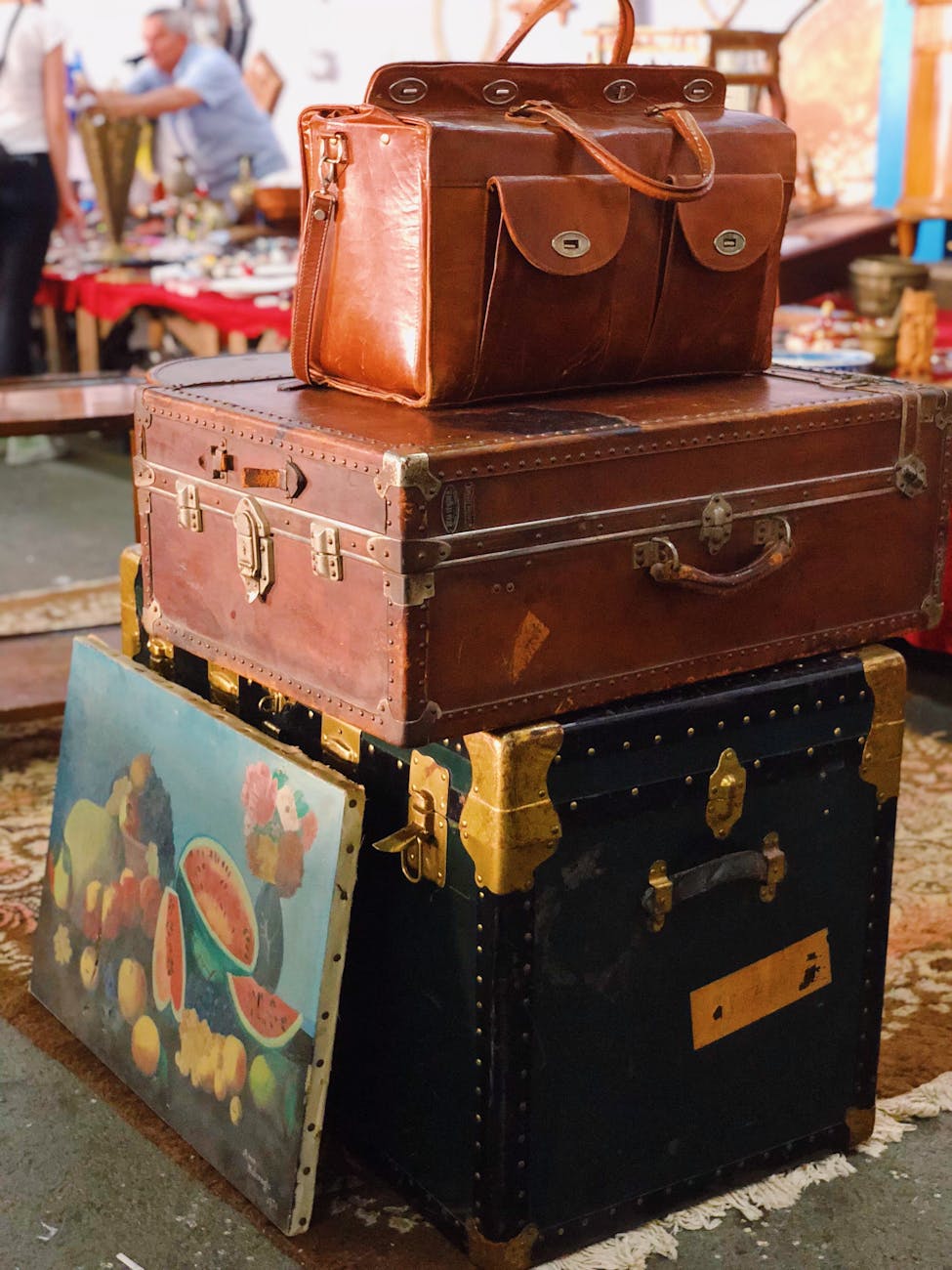 brown leather suitcase and a chest on a market How to Have an Eco-Friendly Home: Ideas to Save Money and Live Sustainably
