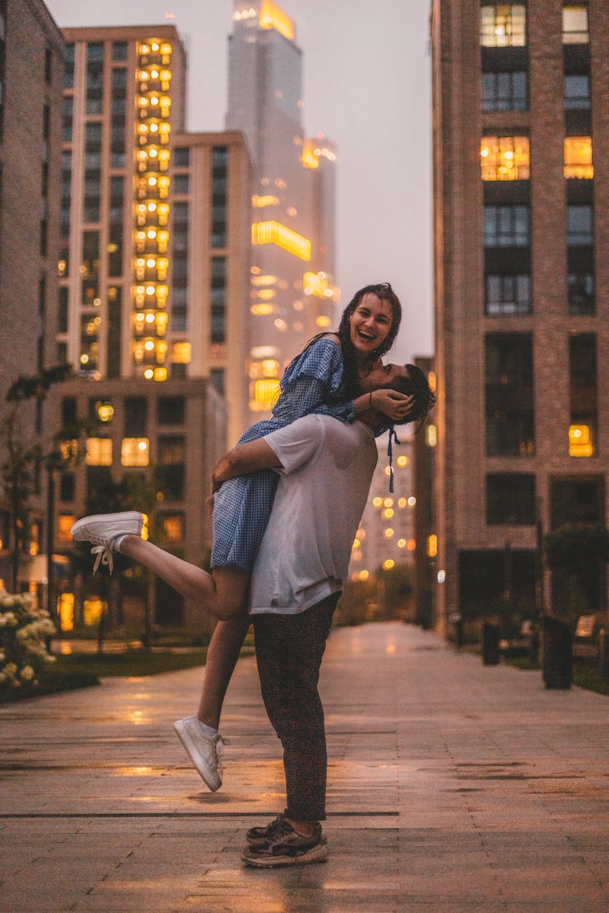 couple embracing on sidewalk 3 Romantic Vacation Ideas for Couples
