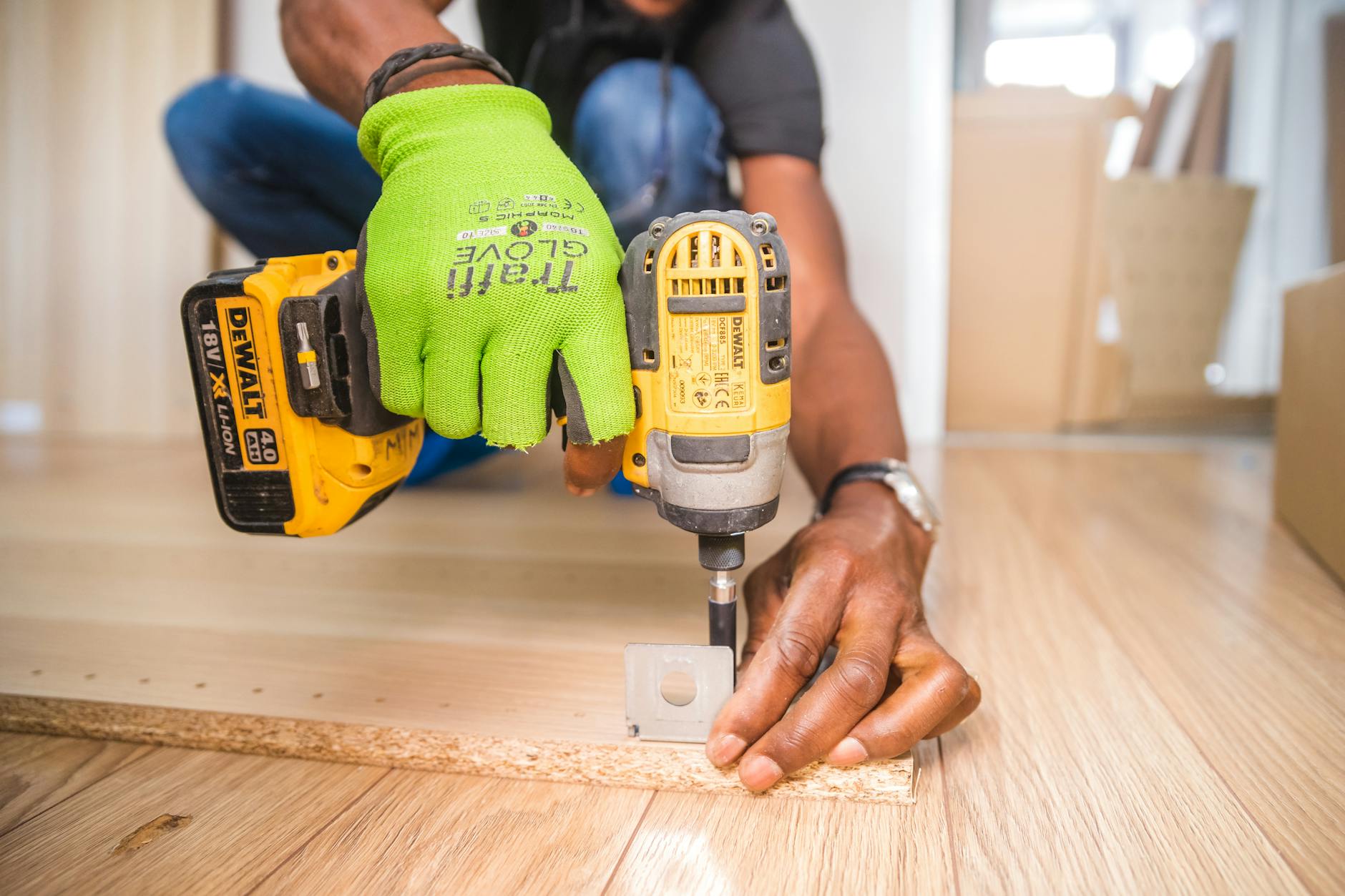 DIY Disasters and How to Avoid Them 10 person using dewalt cordless impact driver on brown board DIY Disasters and How to Avoid Them