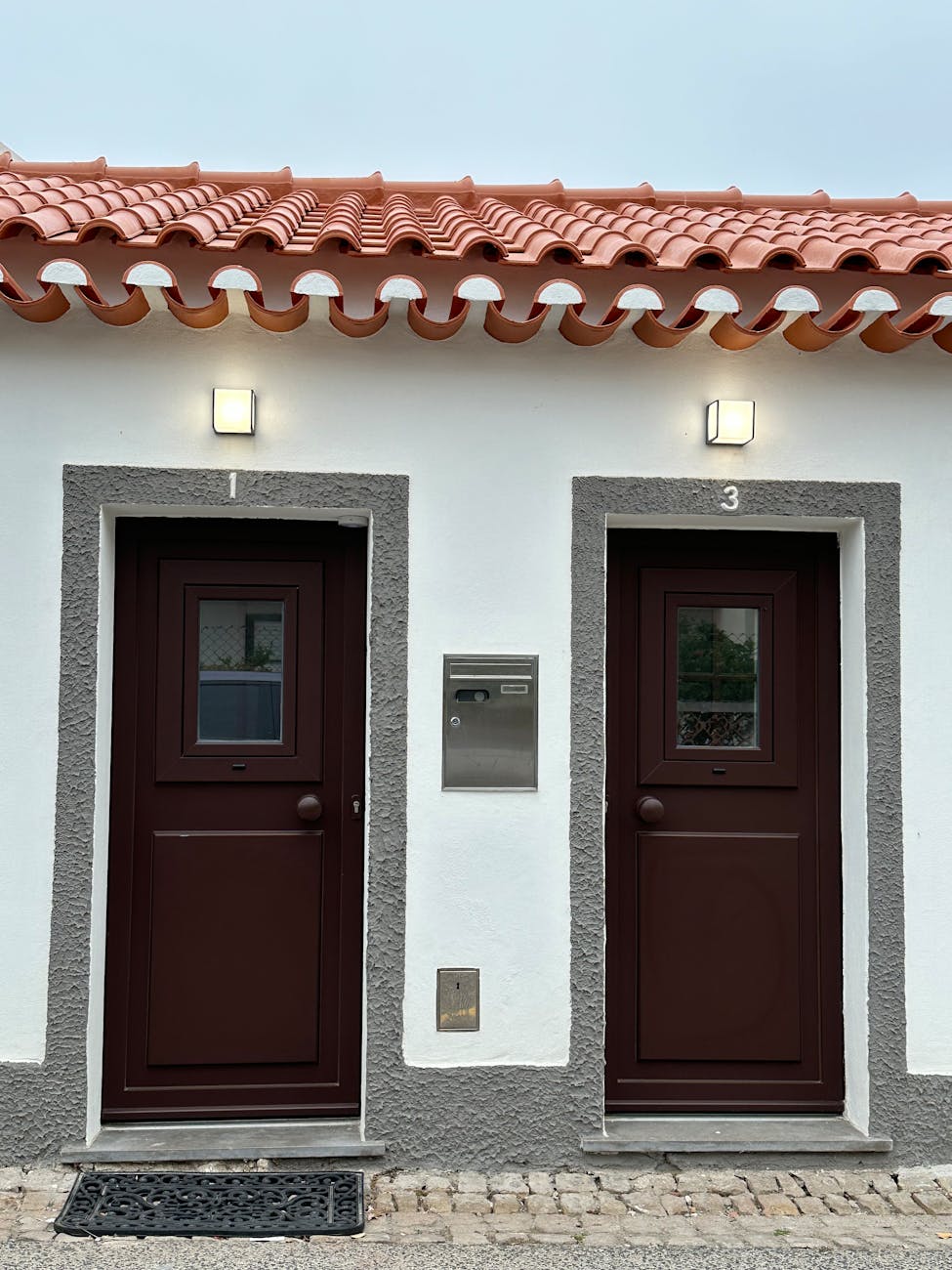 two brown doors with red tiles on the outside Landlord Diaries: Is Passive Income Ever Really Passive?
