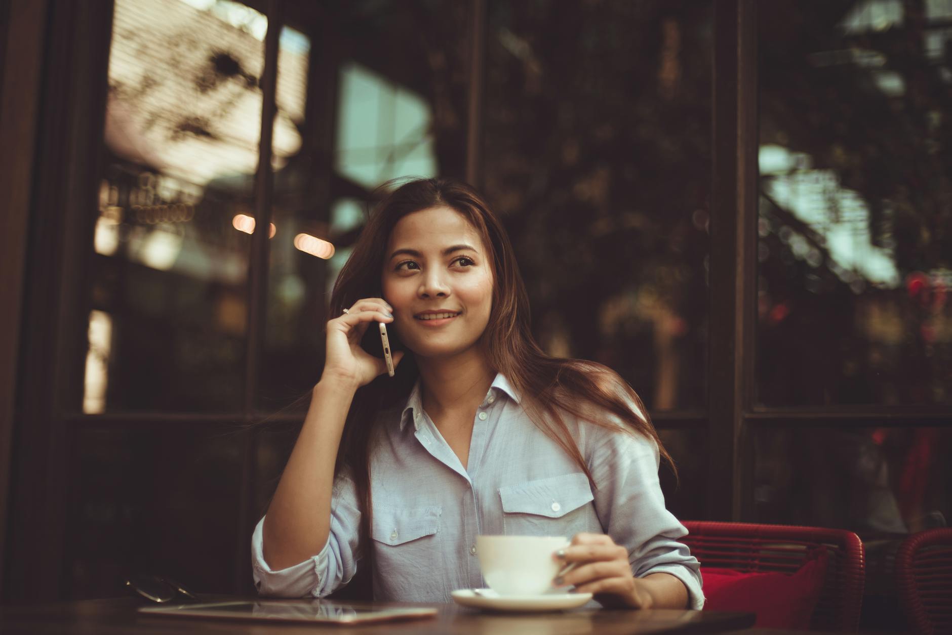 portrait of young woman using mobile phone in cafe 7 Tips for First-Time Home Buyers: How to Make Your Dream Home a Reality