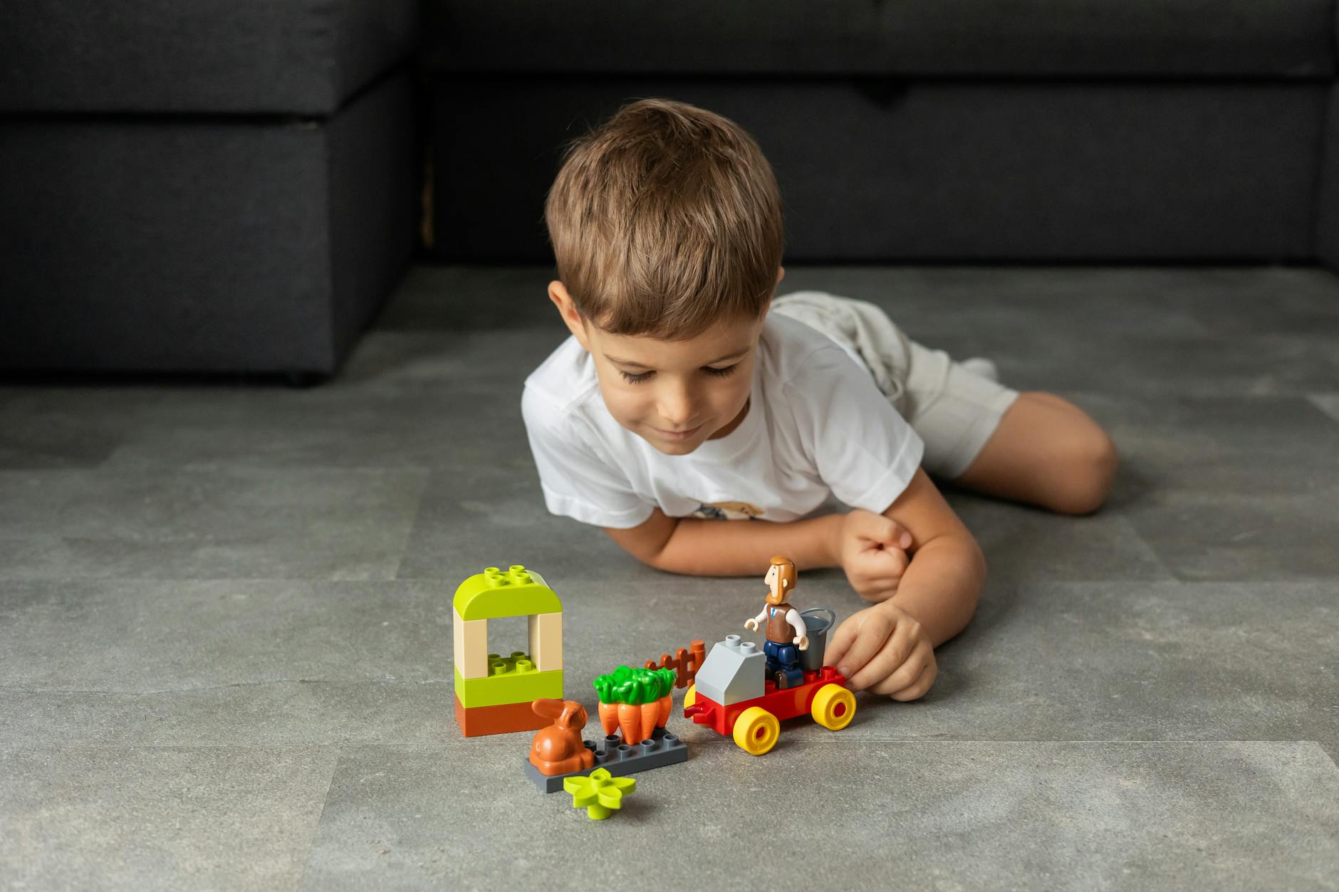 child playing with colorful building blocks indoors How to Survive Renovating Your Home (Without Losing Your Mind as a Working Mom)