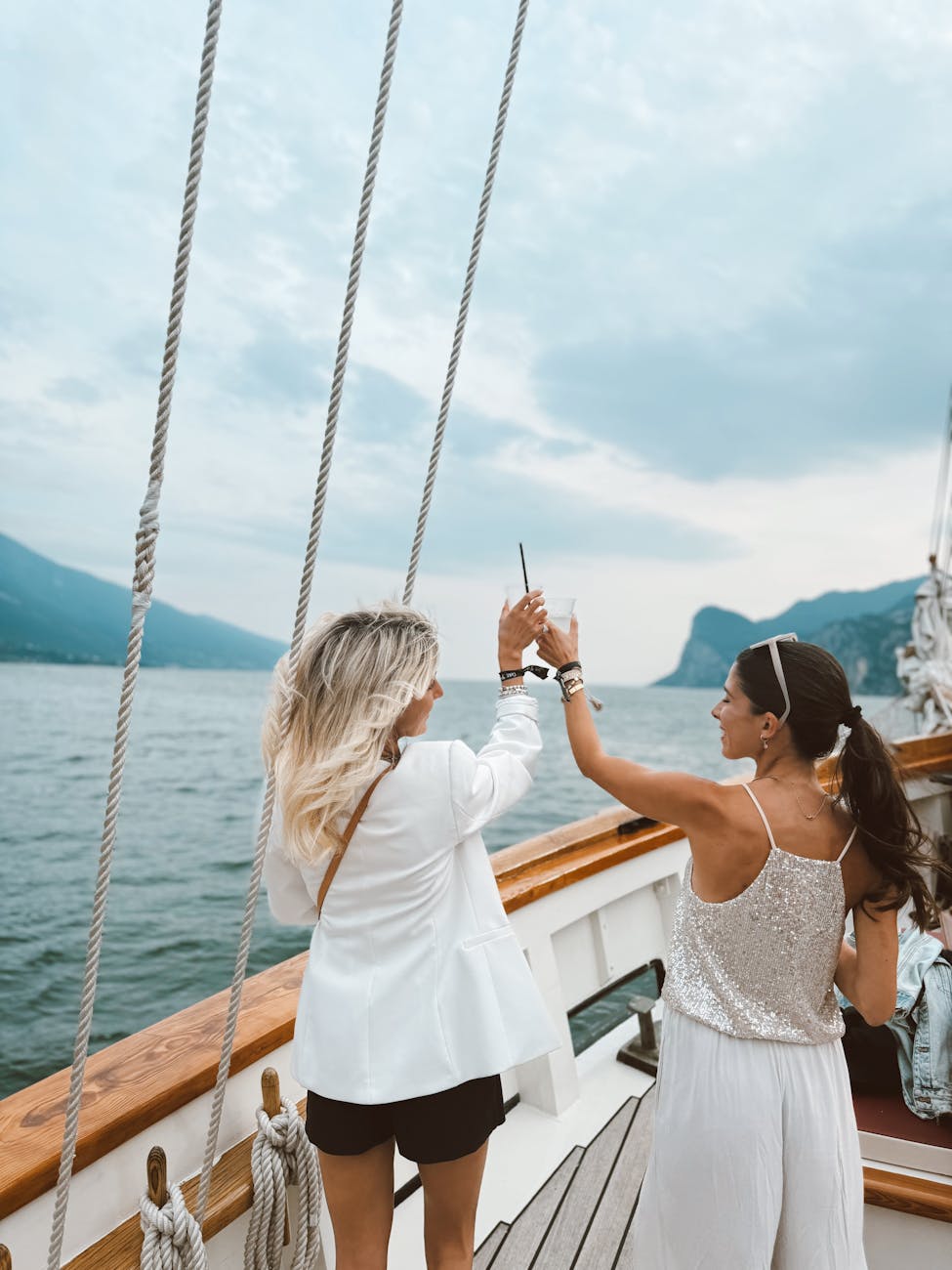 6 Ways to Add Luxury to Your Next Vacation 11 elegant women enjoying yacht cruise on italian lake Add Luxury to Your Next Vacation