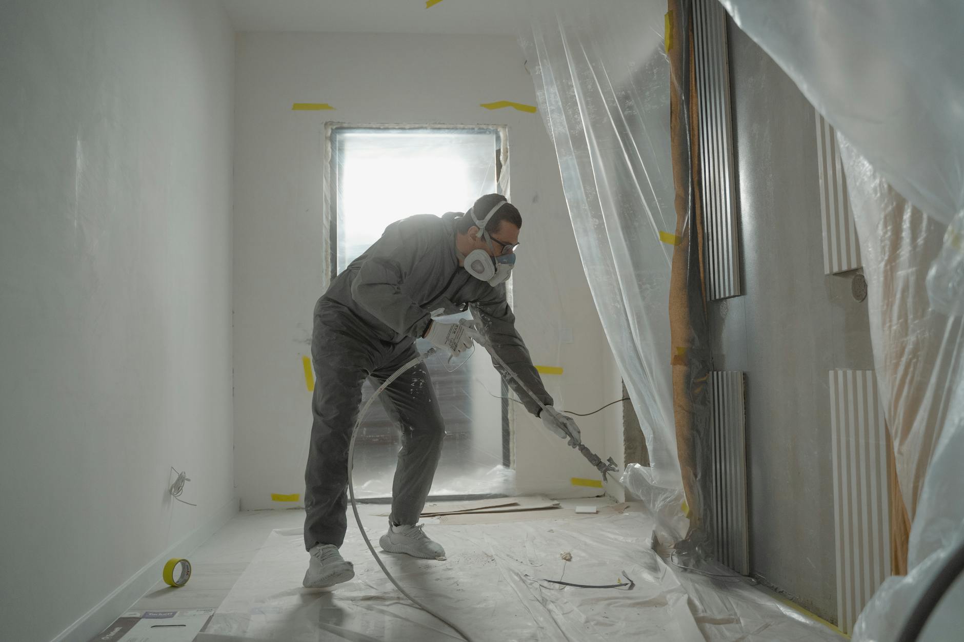 man in black jacket and black pants wearing white helmet How to Survive Renovating Your Home (Without Losing Your Mind as a Working Mom)