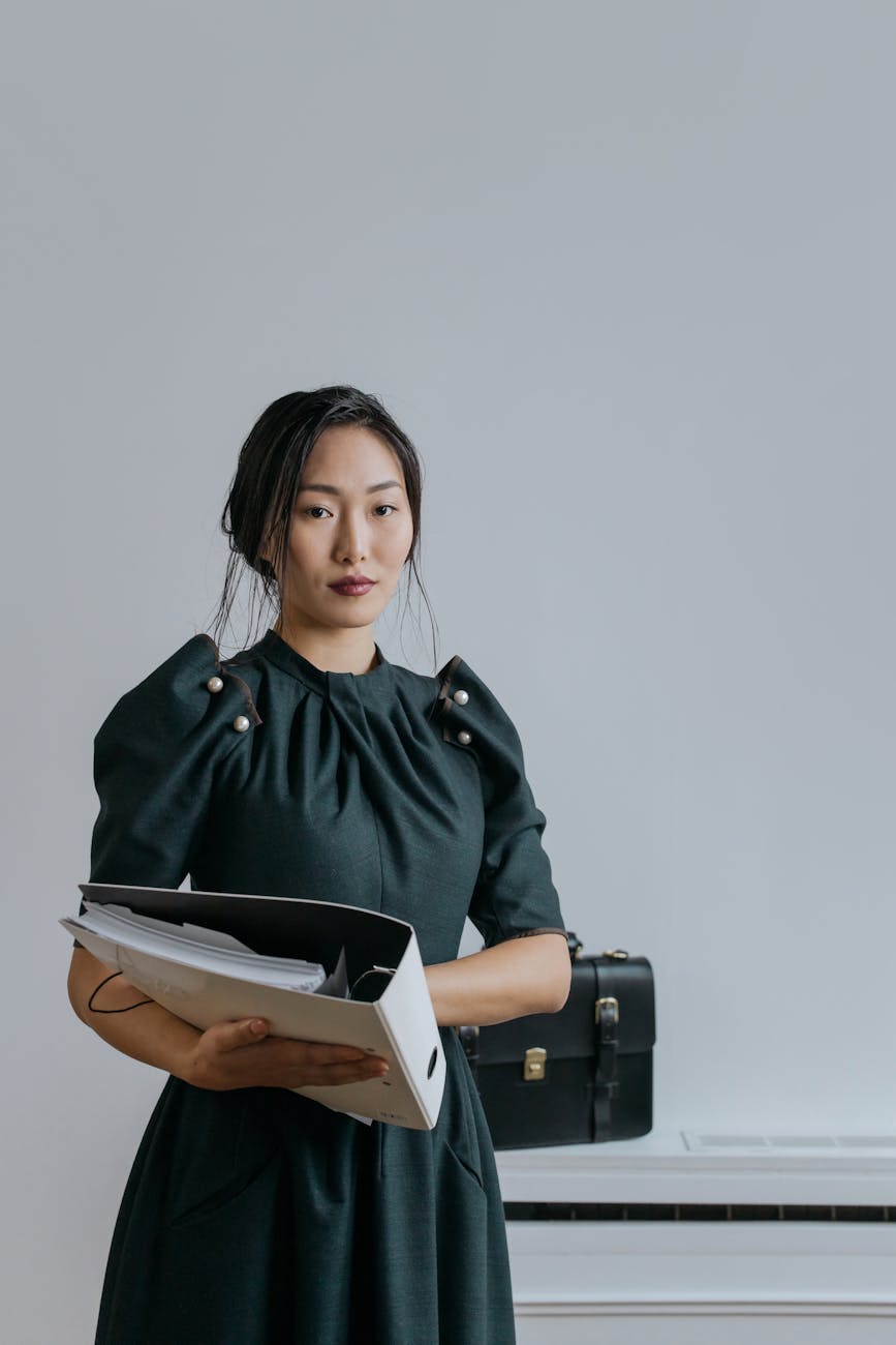 Rethinking Your Career Path? How to Start Working in Real Estate 12 a woman in black dress holding an organizer Rethinking Your Career Path? How to Start Working in Real Estate