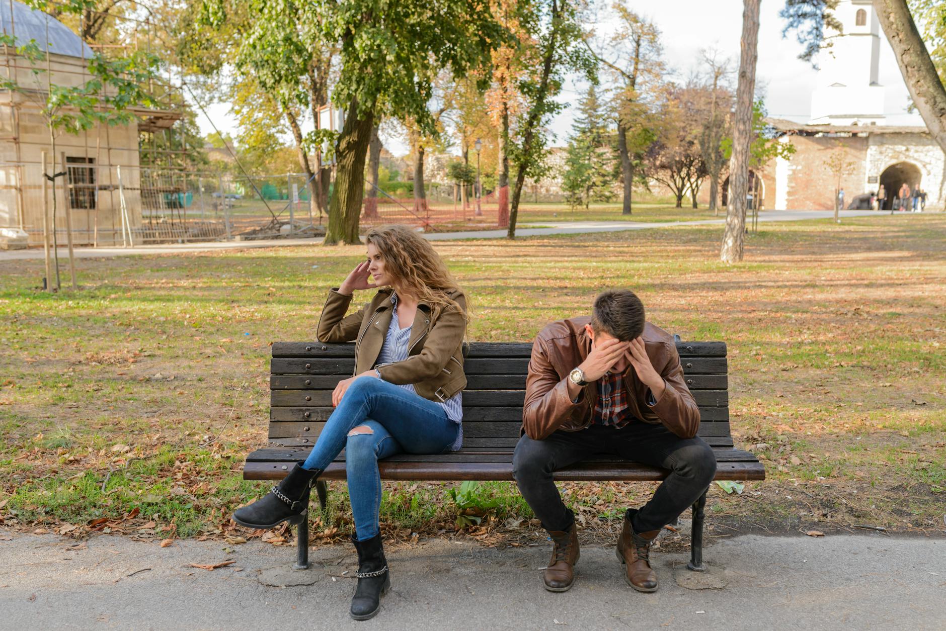 woman and man sitting on brown wooden bench The Power of the Exit: Learning to Leave What’s No Longer for You