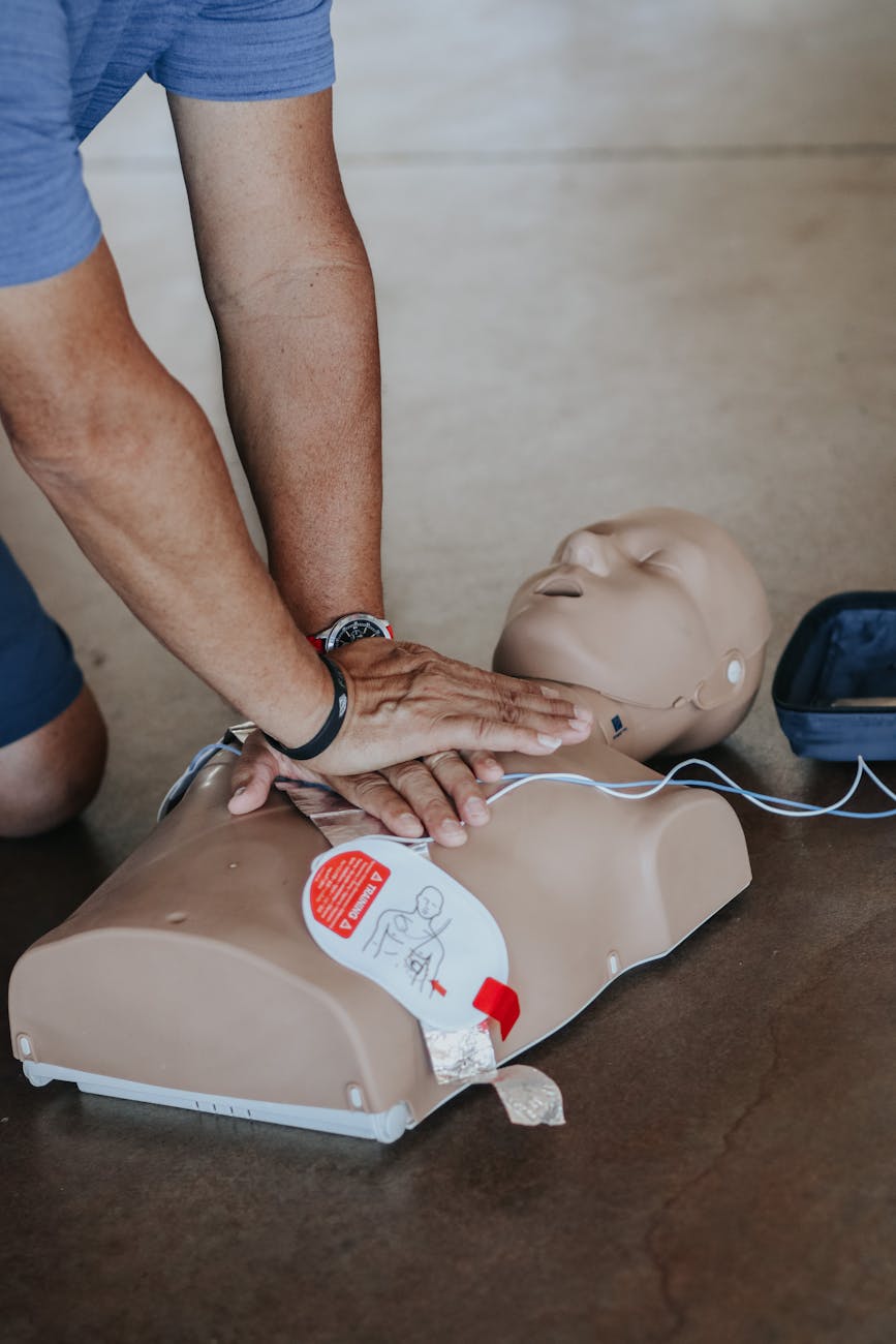 hands of person doing cpr on training dummy The Unexpected Skills That Can Increase Your Career Confidence