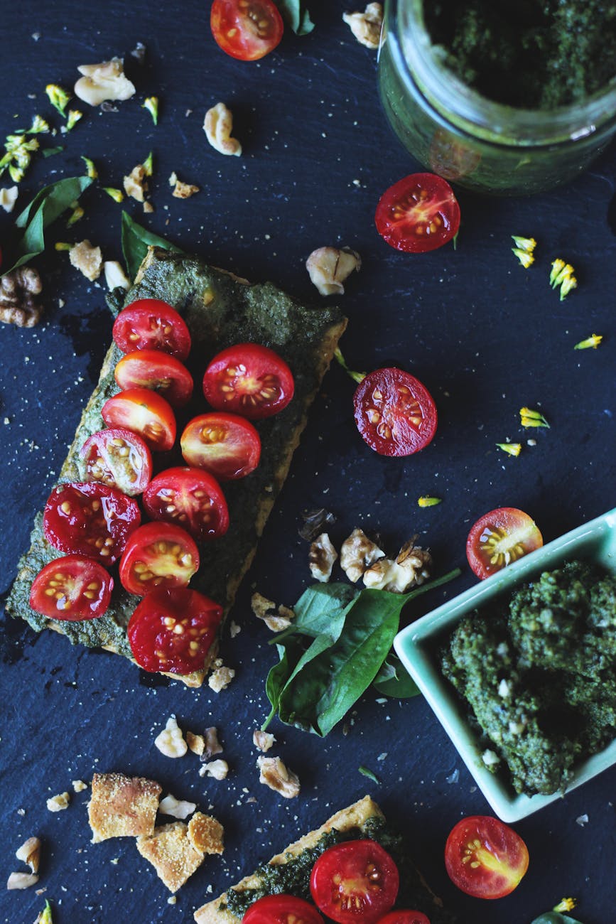 sliced tomatoes and herbs Why You Should Never Leave Crumbs On Your Kitchen Counter Overnight