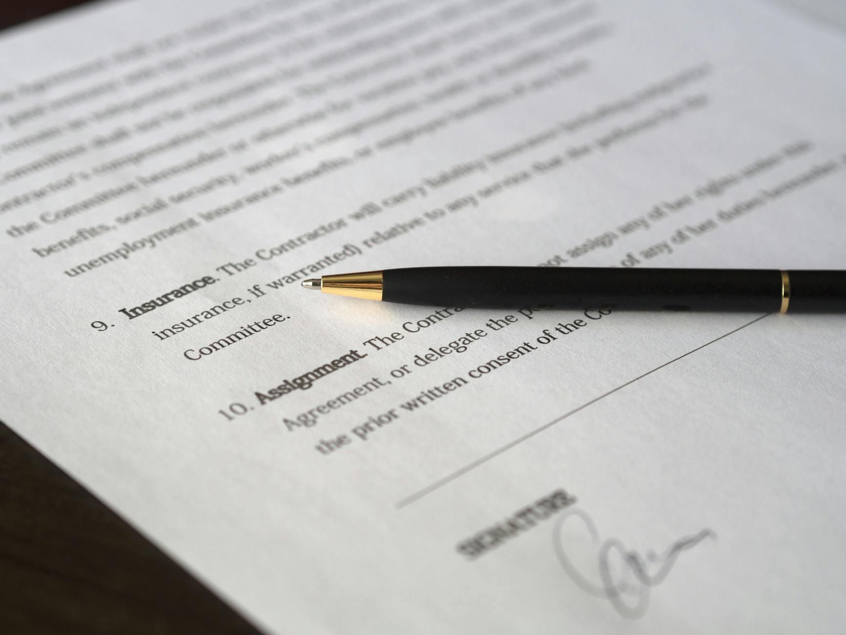 black pen placed on white paper Avoid These Legal Compliance Dangers When Starting Your Business