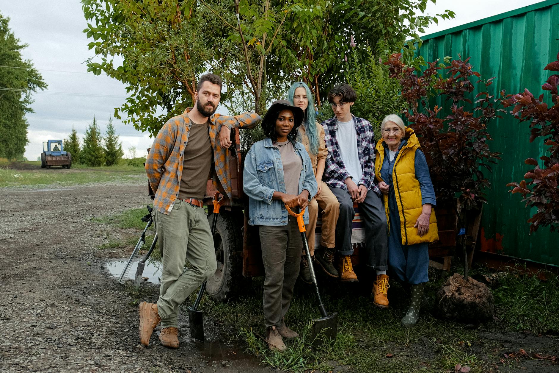 farmers leaning on a tractor while looking at the camera What You Need to Know Before Hiring Family Members