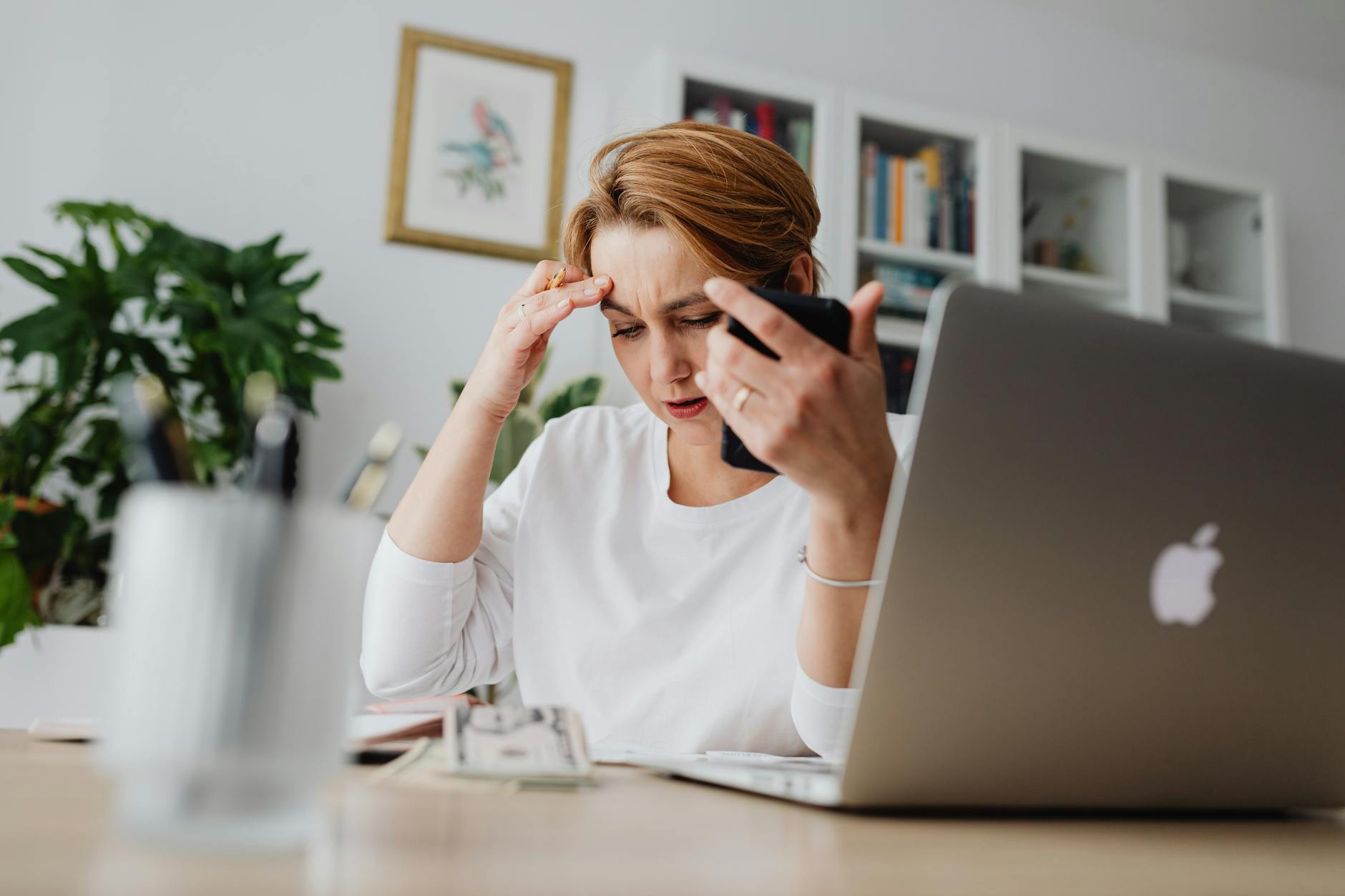 Overwhelmed By Debt? Here's How to Get Through It 10 woman sitting at the desk with the laptop Overwhelmed By Debt? Here's How to Get Through It