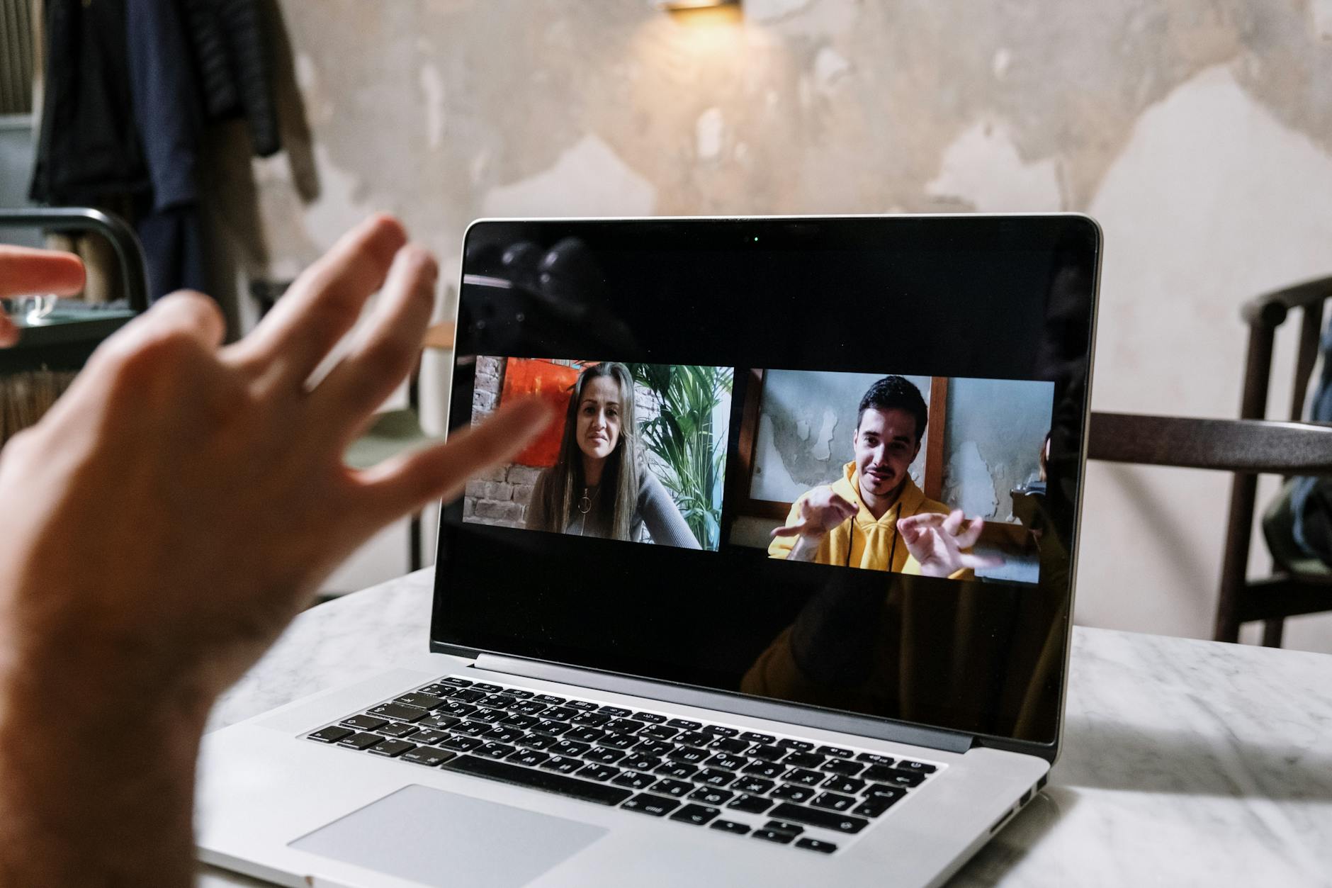 man and woman video call on laptop Why Virtual Meetings Are a Game-Changer for Real Estate Efficiency