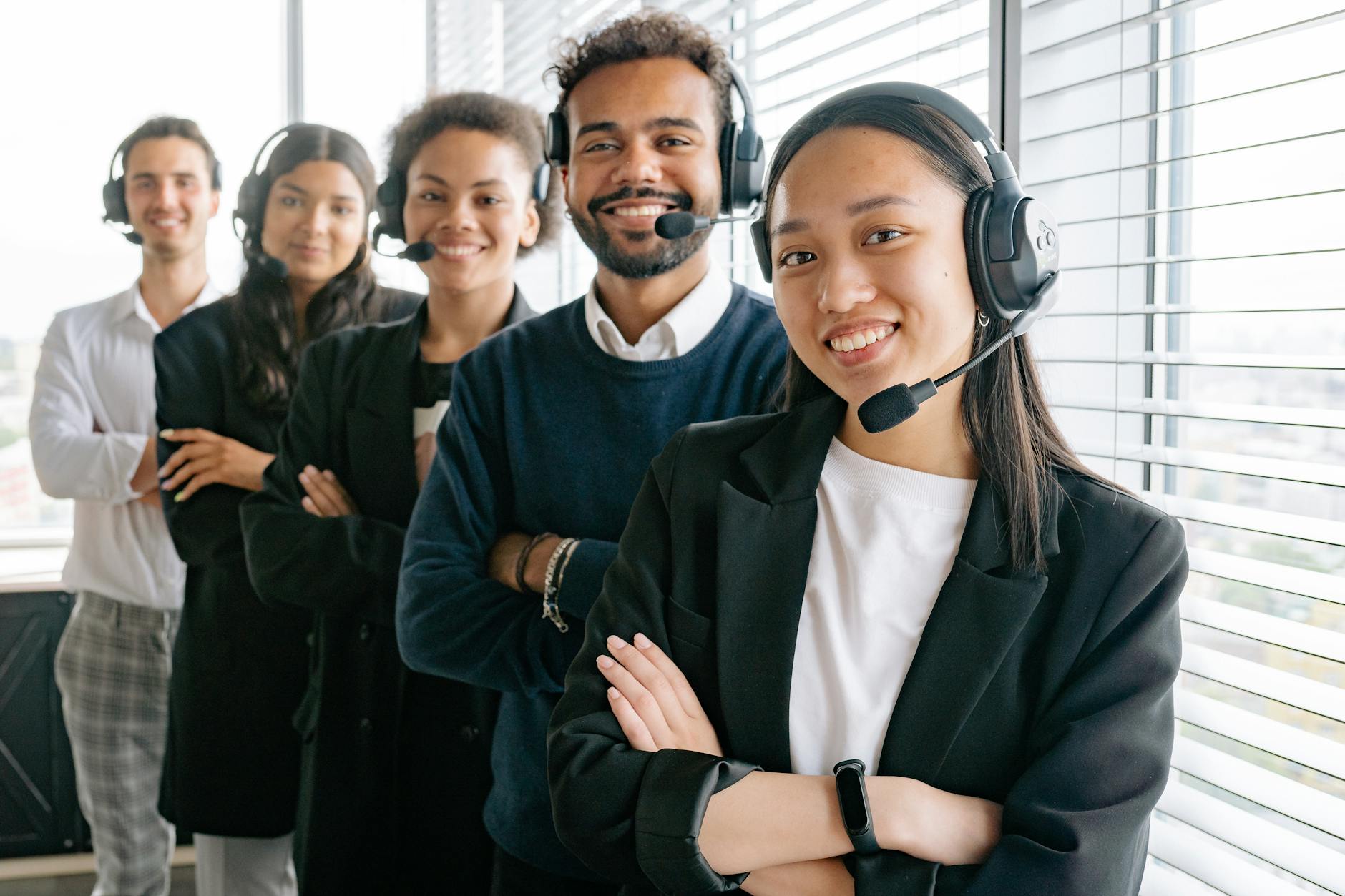 3 Essential Tips to Run a Successful Business & Make a Profit 9 happy call center agents looking at camera 3 Essential Tips to Run a Successful Business & Make a Profit