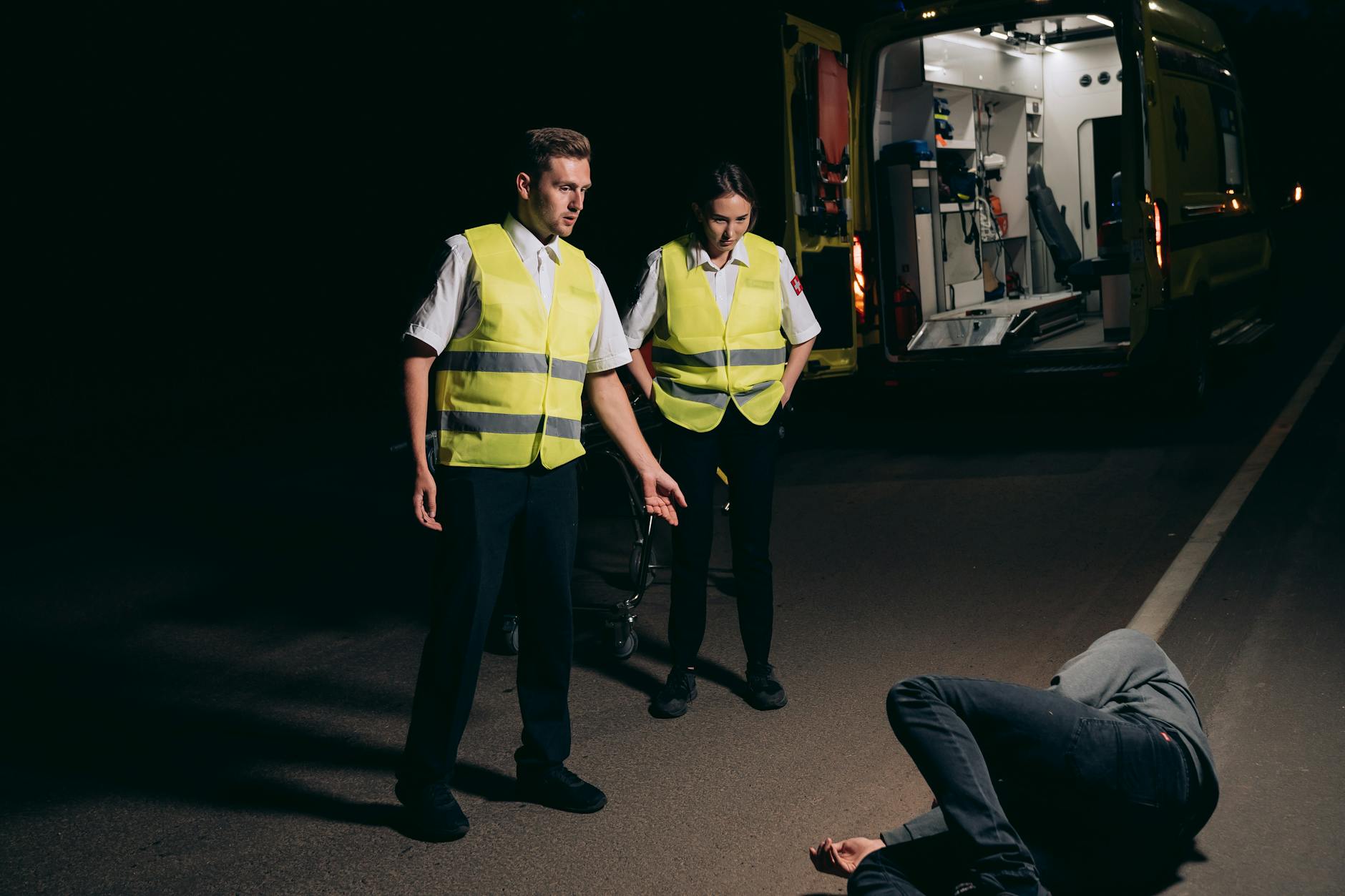 paramedics looking at the person lying on the street Avoid These Legal Compliance Dangers When Starting Your Business