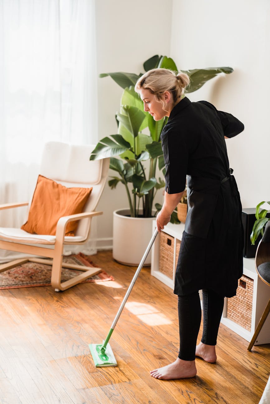 How You Can Seamlessly Prep Your Home for Seasonal Changes 10 a woman sweeping a floor How You Can Seamlessly Prep Your Home for Seasonal Changes