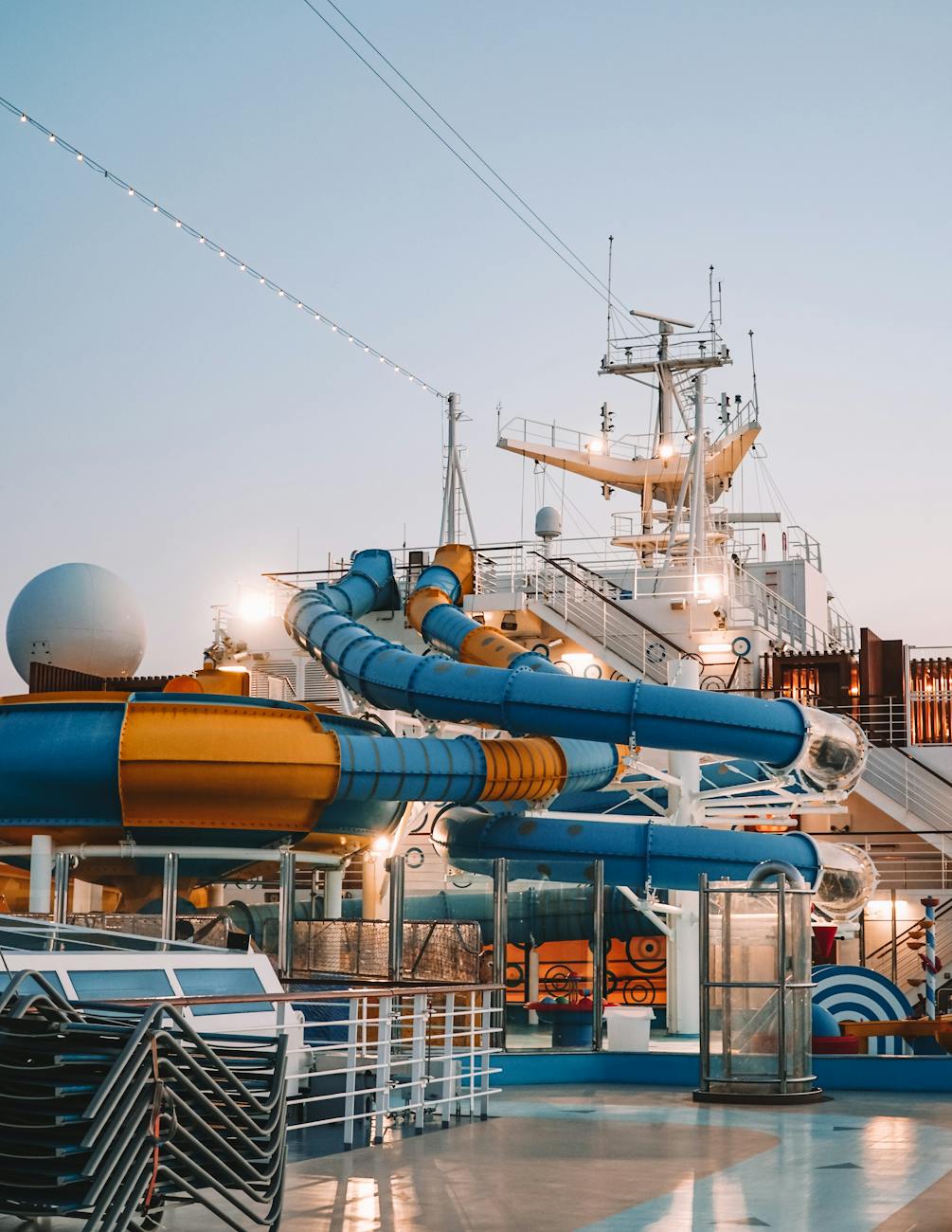 7 Fun Family Vacation Ideas Your Kids Will Love 9 a blue and orange spiral tube slide on a ship deck 7 Fun Family Vacation Ideas Your Kids Will Love