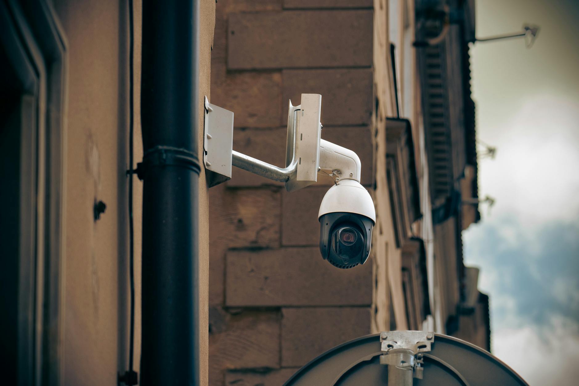 cctv camera on wall in city The Business Owner's Guide to Video Surveillance & VMS for Company Security