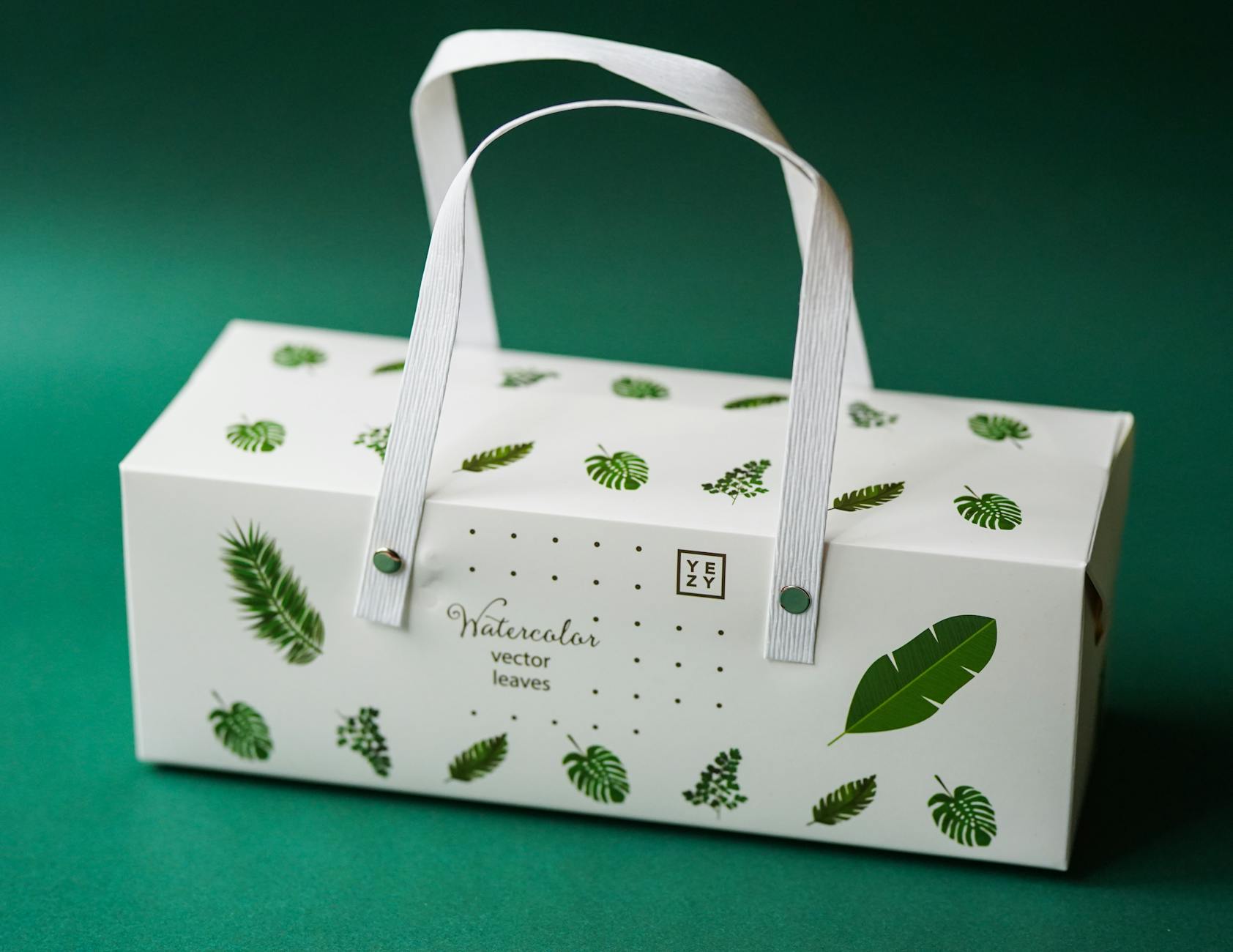 white and green floral print textile Why Packaging Design Is Part of Customer Service Levels (And How to Get It Right)