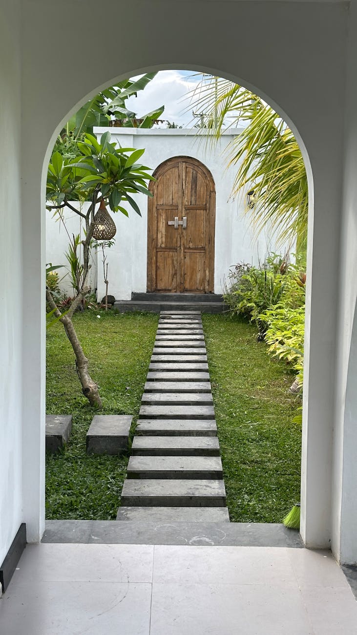 tranquil garden pathway leading to rustic door Home Sanctuary Design: 8 Ways To Create Your Relaxation Space