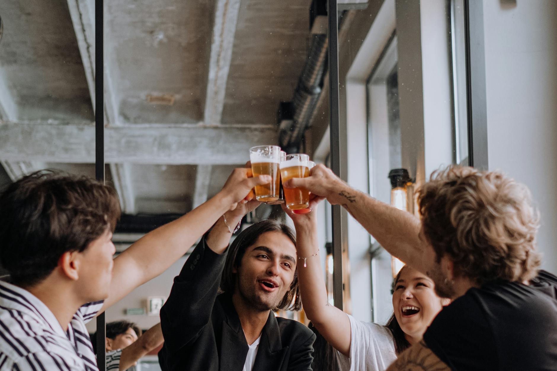 group of young people making a toast Moving to London: Essential Tips for a Stress-Free Relocation