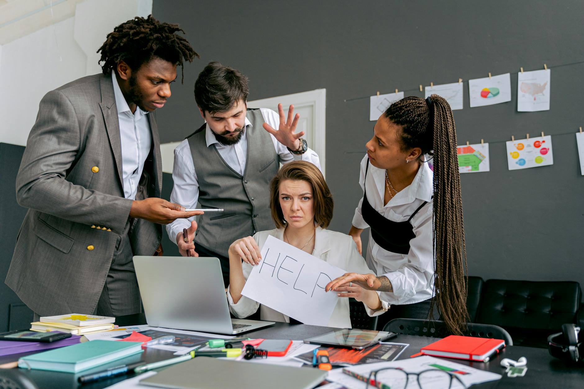 a woman holding a sign for help How to Overcome Business Challenges and Get Back on Track